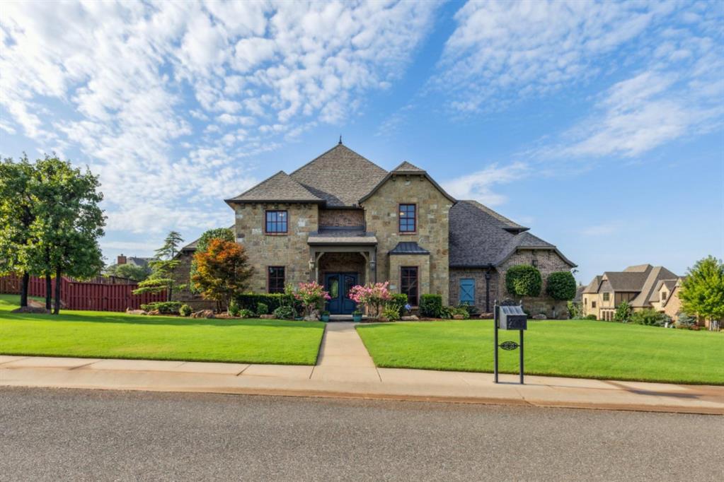 This home boasts an impressive living area with a soaring cathedral ceiling and wood beams, a striking stone fireplace, and stunning windows. The open-concept design seamlessly connects the living room, kitchen, and breakfast area. A spacious island serves as the perfect centerpiece for large gatherings, while a Butler's pantry with a wine bar is conveniently located between the kitchen and formal dining area. The upper-level media room and spacious game room with a small kitchenette make this an ideal home for entertaining. The master suite, an office, and a guest bedroom with a full bathroom are located on the lower level. Upstairs, you'll find two additional bedrooms, each with its own full bathroom. The master bathroom features a stunning dome ceiling with a beautiful chandelier and the master bedroom is enhanced by elegant coffered ceilings. Other bonus features include a large covered back patio with a fireplace, an in-ground storm shelter, and a full sprinkler system. The roof was recently replaced in 2024. This is a special home full of warmth and functionality. Come see it today!