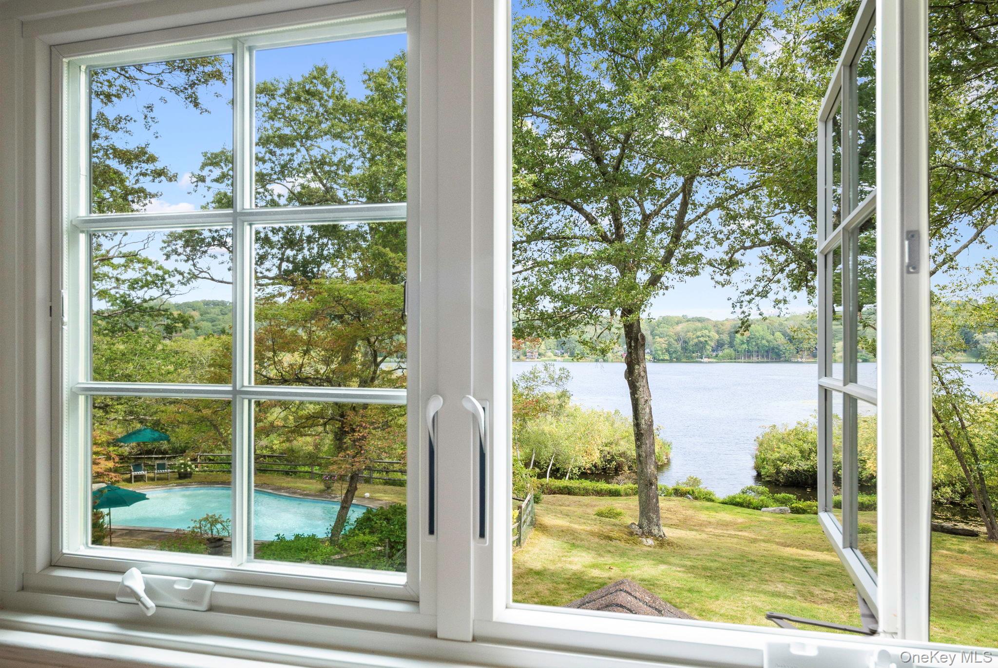 Rare lakefront privacy in this charming 1940's vintage home with lakeside pool and almost 3 acres of flat, usable land. A stunning site, bordered by a forever green land preserve, broad lawns and water. The glacier formed lake is crystal clear, attracting an amazing display of birds and wildlife. Fabulous fishing, paddling, swimming, sailing. Not a cottage but a true house, the home is solidly built, typical of the vintage, possessing many period details all combining to charming effect. 3 bedrooms can easily live as 4, or even 5. Also included is a 2-story pool house with storage, deck and finished room upstairs. Ideally located, with the 4700 acre Pound Ridge Reservation only half a mile away and adorable Scotts Corners nearby, this area may be the most rural feeling in all of Westchester County and yet the immediate surroundings offer every country amenity - large parks, hiking, biking, riding, paddling, camping & many other recreational activities, plus nearby villages and inns for shopping, dining, farmer's markets, art theatres & more - Scotts Corners, New Canaan, Katonah, Bedford, Ridgefield, South & North Salem, Cross River and others are all just a short drive away, as are the Inn at Pound Ridge and the Bedford Post Inn. A sublime property as is, possessing tremendous potential, only 1 hour from New York City.