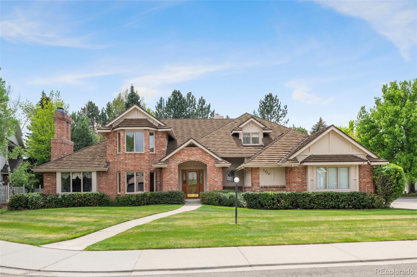 OPEN SUNDAY 1-3 PM! Welcome to 7334 S. Meadow Ct., ideally situated in the South Meadow neighborhood near the Boulder Country Club. This sprawling home is set on a desirable cul-de-sac directly across from the neighborhood park, offering both privacy & convenience. Positioned on a beautifully landscaped .32 ACRE corner lot, the property features a circular driveway, 3-car side-load garage, mature trees, and a serene, park-like backyard. The expansive outdoor setting provides a perfect backdrop for relaxing or entertaining. Inside, the home showcases a spacious and thoughtfully designed floor plan with abundant natural light, soaring ceilings, and seamless flow thru-out. The kitchen serves as the heart of the home, opening to an impressive family room with two-story ceilings, exposed wood beams, and a cozy wood-burning fireplace with brick hearth. A formal dining room and living room, both enhanced by dramatic ceiling heights and large windows, create elegant spaces for gatherings. The main-level primary suite offers a private retreat, complete with a 5-piece bath & direct access to the backyard patio with pergola. Upstairs, 3 generously sized bedrooms provide comfort & privacy. Two bedrooms share a full bath with dual sinks, while the 3rd includes its own en-suite bath. A versatile loft area with built-in shelving is ideal for a home office or flex space. The finished lower level adds even more living space, featuring a large recreation/media/exercise room, a 5th bathroom & ample storage. Enjoy easy access to neighborhood amenities including parks, tennis courts, and scenic greenbelts, along with nearby trails, shops, restaurants, and breweries in Gunbarrel. The home also offers the option to attend either Boulder High or Fairview High School.