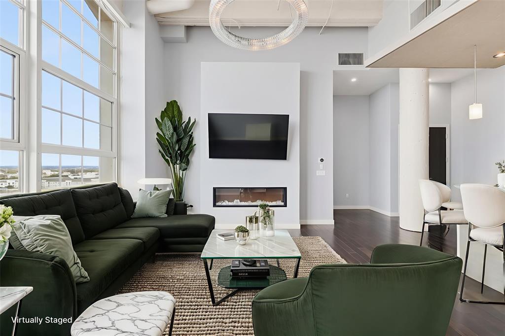 Discover the perfect blend of luxury & convenience in downtown living at the renowned Montgomery Plaza! This 8th-floor West Tower unit features 3 bedrooms & 3 bathrooms with spectacular panoramic views of the Fort Worth skyline, soaring cathedral ceilings, & an open-concept design that enhances both everyday living & entertaining. Two of the three bedrooms boast full en-suite bathrooms, ensuring privacy & comfort, while a third full bathroom provides guest accommodations. A versatile additional space can serve as a dining area or a sophisticated large office. Relax in the living room, accentuated by an fireplace for added warmth & ambiance, & control the motorized shades with ease to adjust natural light or privacy at the touch of a button. The chef's kitchen impresses with premium finishes, sleek cabinetry, & a layout that seamlessly flows into the living area. A unique highlight of this unit is the full-size laundry room with a sink—an uncommon yet valuable convenience in condo living. The property also includes two side-by-side deeded parking spaces (2203 & 2204), a true luxury. Enjoy the top-tier amenities that Montgomery Plaza offers, including a rooftop pool with six private cabanas & a spa, two outdoor kitchens, multiple fire pits, a corn hole setup, a putting green, an herb garden, a modern fitness center, a 24-hour concierge, an owner's lounge with a bar, & a 14-seat media room—theater. Located just steps from Fort Worth's most exceptional dining, shopping, & cultural attractions, this residence offers a true lock-and-leave lifestyle you will love. A brand-new HVAC system in 2024 for piece of mind. Embrace modern urban living blended with historic Fort Worth charm at Montgomery Plaza, where convenience meets vibrant energy, with restaurants & retail shops nearby. Montgomery Plaza is more than just a residence—it's an elevated lifestyle combining modern convenience with unmatched accessibility right in the heart of the city!