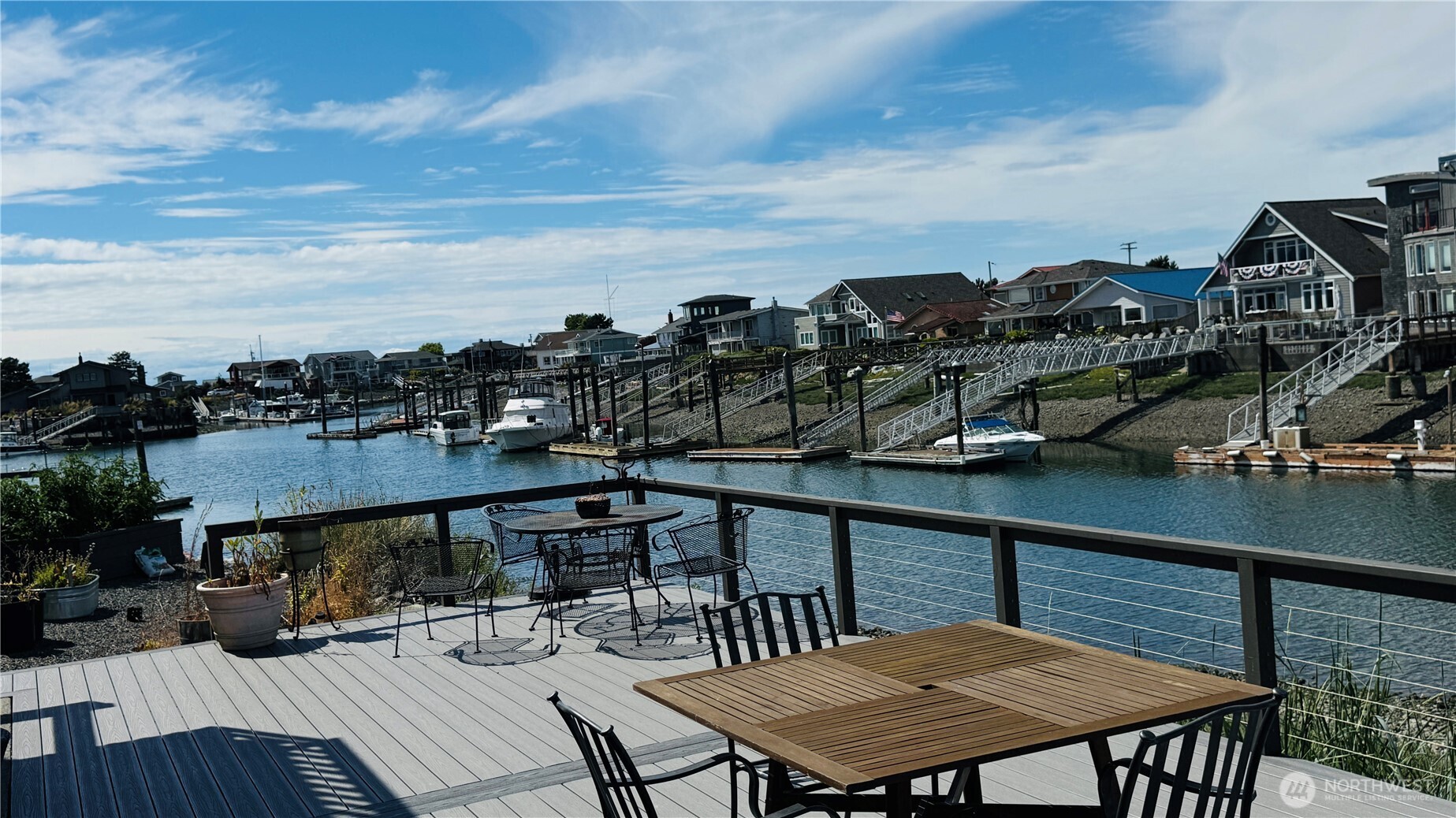 Own the View. Dock the Boat. Live the Dream. Imagine your biggest decision this weekend is whether to cast off for the San Juan Islands or stay home and watch another unforgettable sunset from your deck. Welcome to Sandy Point, where the pace slows, the views never get old, and life revolves around the water. Wake to marina views, sip your morning coffee as eagles soar overhead, then spend your days boating, fishing, crabbing, kayaking, or paddleboarding before returning home to the peaceful rhythm of the harbor. Nestled in an intimate waterfront community, this marina-front townhome presents a rare opportunity to create your own coastal retreat in a location that simply can't be duplicated. Whether you're searching for a full-time residence, a weekend escape, or a waterfront investment, this is a place where memories are made on and off the water. Bring your vision and make it your own while embracing one of Whatcom County's most treasured waterfront communities. Deeded 37' moorage included. Seller financing may be available for qualified buyers. "Bring your vision. The view is already perfect."
