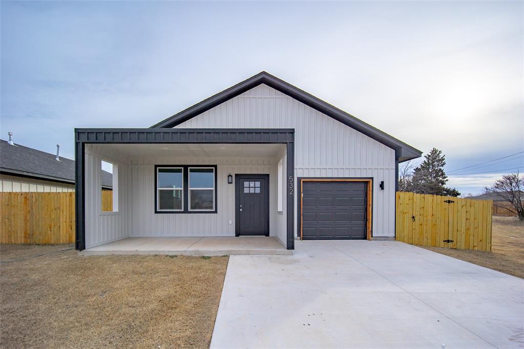 Step inside this beautiful new construction home that offers you luxury living at an affordable price. This home warmly greets you from the large covered front porch to the inside where durable large plank marble flooring awaits you in every room. The living room has an electric fireplace to add a warm glow to those colder nights. The kitchen has a brand-new stainless-steel appliance package along with a pot filler, large pantry and beautiful granite countertops. The primary bedroom has a lovely accent wall adorned with reading lamps and a connecting bathroom featuring dual sinks, a soaking tub, a tiled shower and a walk-in closet. The two secondary bedrooms both have access to the hallway bathroom that features a tiled tub/shower combo. There is a large laundry room that has plenty of cabinetry space along with access to your oversized one car garage. The backyard has plenty of room for a storage shed or raised gardens and features a privacy fence with side access gate.