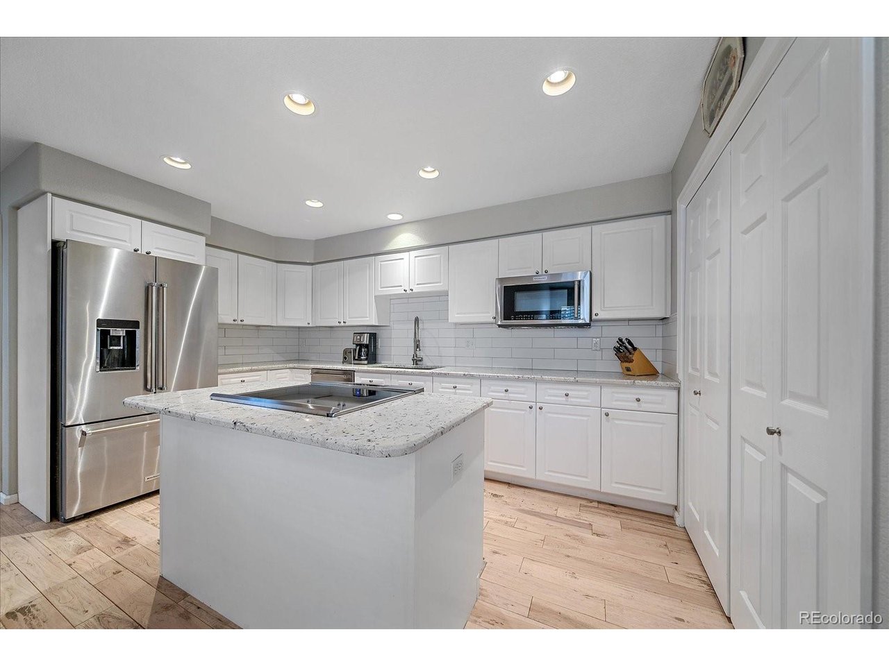 Stunning Upgraded Townhome with Finished Walkout Basement.Welcome to this turn-key, feature-packed townhome designed for modern comfort and effortless entertaining! Step onto the main floor and take in the rich, new hardwood flooring, custom plantation shutters, and a bright family room with soaring, vaulted ceilings. At the heart of the main floor sits a dramatic double-sided gas fireplace shared between the family room and spacious dining area. The updated kitchen boasts new feathered granite countertops, sleek white cabinetry, stainless steel appliances, a generous pantry, and an eat-in dining space. Step out from the main level onto the brand-new deck to enjoy outdoor relaxation.Upstairs, you will find two complete bedroom suites. The primary retreat features private access to a brand-new balcony, a spacious walk-in closet, and a gorgeous, newly remodeled 5-piece primary bathroom. The secondary bedroom also offers its own tastefully updated full ensuite bath.The finished walk-out basement expands your living space with radiant-heated, wood-look tile floors for ultimate comfort. This lower level includes a third bedroom, a full bathroom, a dedicated laundry room, and seamless access to a private covered patio. This prime Lone Tree is nestled in a quiet, established neighborhood near the Lone Tree Golf Club! Enjoy unbeatable convenience just minutes from Park Meadows, Bluffs Regional Park, Sky Ridge Medical Center, and the Lone Tree Arts Center. An ideal commuter hub with fast access to I-25, C-470, DTC, and Lincoln Light Rail-all within top-rated Douglas County Schools!