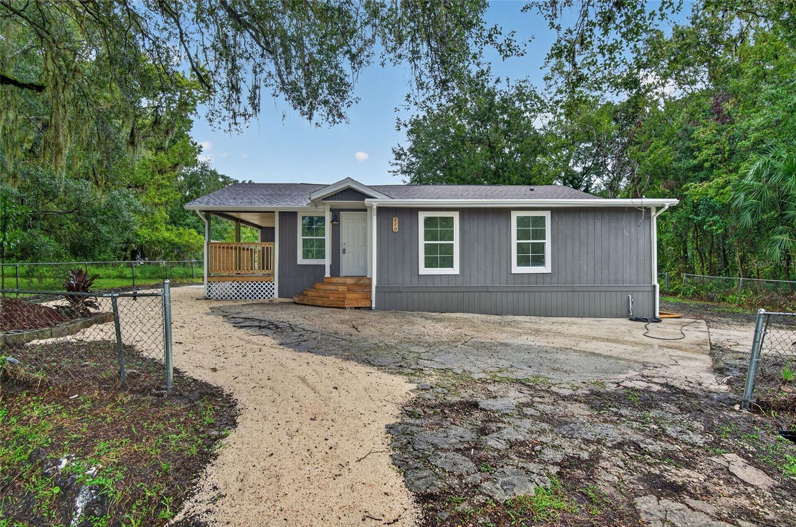 Beautifully remodeled 4-bedroom, 3-bath home in a great Brooksville location! Featuring a NEW ROOF and NEW AC, this home combines modern finishes with inviting spaces inside and out. The open living area showcases wood-look flooring, neutral colors and abundant natural light. The beautiful kitchen takes center stage with white cabinetry, contrasting hardware, stainless steel appliances, a stylish range hood and a large island with breakfast-bar seating and pendant lighting—perfect for everyday meals and entertaining. Updated bathrooms include attractive tile finishes and a glass-enclosed walk-in shower. Enjoy your morning coffee on the covered porch or create your own outdoor retreat in the fenced yard. Situated on approximately 0.19 acre in Mitchell Heights, this refreshed home is ready for its next chapter. Schedule your showing today!