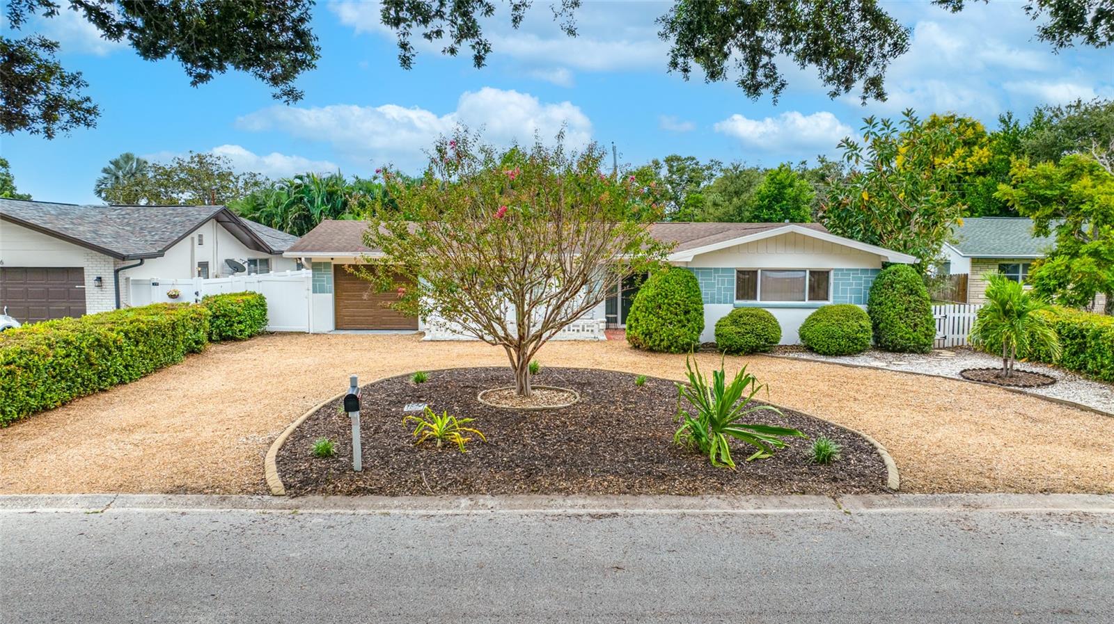Welcome to this inviting open-concept home offering a wonderful blend of indoor comfort and Florida outdoor living. The spacious floor plan is perfect for entertaining family and friends, while the beautifully landscaped tropical backyard creates a private retreat with a newly covered porch and plenty of room to add a pool.The kitchen features newer wood cabinetry, granite countertops, and newer stainless steel appliances, creating a warm and functional space at the heart of the home. Additional updates include luxury vinyl plank flooring, an updated main bathroom, a new HVAC system installed in 2026, and a newer hurricane-rated garage door.The Florida room provides additional living and entertaining space with convenient access to the backyard. A second bathroom is located in the garage and is easily accessible from the Florida room, making it especially convenient for outdoor gatherings.Ideally located near popular restaurants, shopping, and everyday conveniences, with the beautiful Gulf beaches just a few miles away. This home offers a relaxed Florida lifestyle in a convenient Largo location.