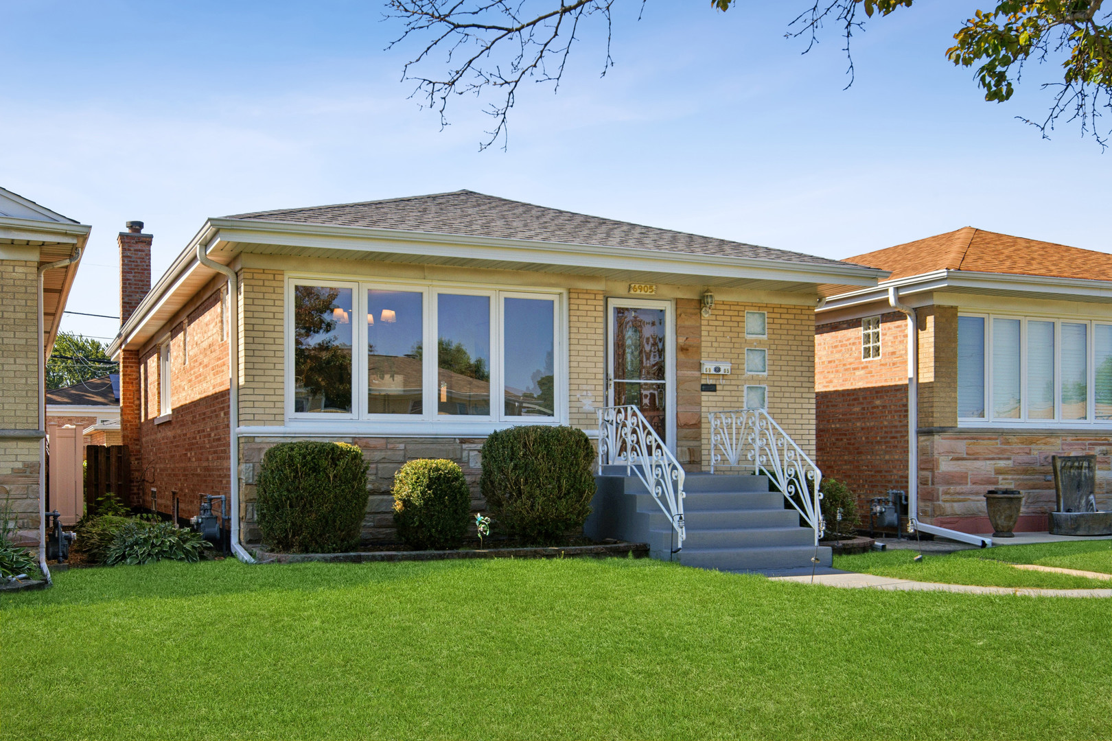 Welcome to this spacious 3 bed 1.5 bath brick ranch, filled with natural light and featuring beautiful hardwood floors throughout. The inviting kitchen offers granite countertops, stainless steel appliances, and a dining area that opens into a quaint sunroom. The fully finished basement provides additional living space with a versatile recreation room, convenient half bath, and a generously sized laundry room complete with a utility sink. Outside, the 2 car garage features a convenient party door leading to the paved yard and garden, creating an ideal setup for entertaining or enjoying the outdoors.