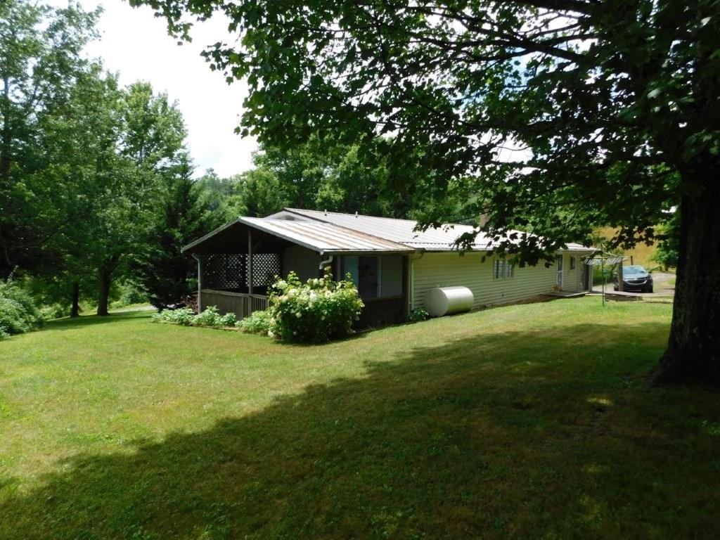 Check out this unique opportunity to own a rural home on 10 acres with a built in business opportunity! This home features over 2,000 finished square feet of living space and comes already set up with pottery equipment and supplies! The home has 3 bedrooms, 2 full baths, 3 walk-in closets, 2 linen closets and partial unfinished basement. Lots of space for business and living area! Has 4 heat sources including electric, kerosene monitor, propane gas for kiln and home, gas fireplace, woodstove in the basement and flue in the kitchen. Pottery equipment includes 3 kilns, 2 pug mills, slab roller, glaze formulating table and extra table allowing for a higher volume of production! The 10.74 acres has a nice mix of woods and pasture land. There is a barn, old fencing, work shed with electric and another storage building. Beautiful level to gently sloping yard with plenty of garden space. This property would make an ideal mini farm or homesteading property with the potential to create your own income with the pottery equipment.