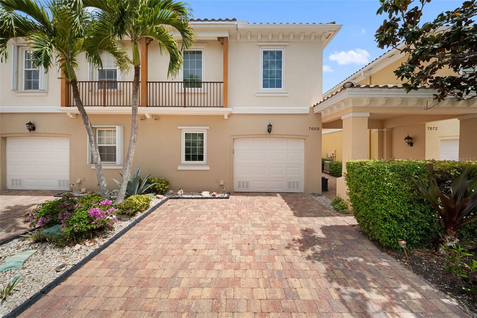 Beautifully updated 3-bedroom, 2.5-bath Catalina townhome in the highly desirable Villagewalk on Palmer Ranch, offering a dynamic, amenity-rich setting ideal for full-time living. The interior features a stylish kitchen with quartz countertops, stainless steel appliances, and a tile backsplash, along with updated bathrooms and two well-appointed guest bedrooms. Additional upgrades include IMPACT windows, accordion shutters on the great room sliders, a/c 2018, plantation shutters in bedrooms and remote-controlled blinds in the great room. Enjoy the serene views from the spacious screened lanai, surrounded by refreshed landscaping that enhances privacy and outdoor living. Residents enjoy an exceptional lineup of amenities including a restaurant and tiki bar, resort and lap pools (both geothermal heated), pickleball courts, and six lighted Har-Tru tennis courts. The community also features a fitness center, clubhouse, event space, boutique, hair salon, and on-site gas station. An HOA manager and activities coordinator provide a full calendar of events, creating an engaging and social atmosphere year-round. Miles of walking trails, scenic bridges, and lakes weave throughout the lushly landscaped grounds. A 24-hour manned gate adds security, while HOA fees include irrigation and landscaping for low-maintenance living. Conveniently located near Siesta Key Beach, the Legacy Trail, shopping, dining, medical facilities, and the arts. A perfect opportunity to enjoy an active, connected lifestyle in one of Sarasota’s most sought-after communities.