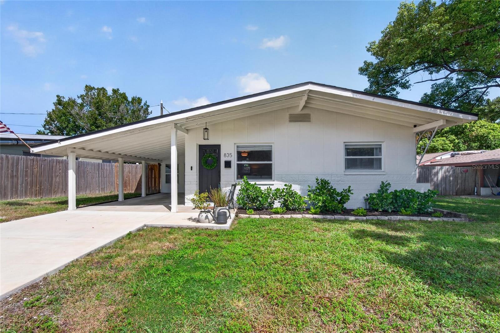 More yard, more breathing room, and a fresh, open feel in St. Pete! This lovingly maintained 2-bedroom, 1-bath home has 882 square feet of inviting living space on an oversized lot just under a quarter acre. The half wall between the living room and kitchen is gone, giving the space a more open feel, with refinished kitchen cabinets and vinyl flooring throughout the living areas, installed in 2022. And yes, the laundry is inside, where it belongs! The kitchen appliances, washer, and dryer were updated in 2023, along with the bathroom vanity and toilet. The A/C is serviced annually, and the roof is in great shape and was just certified by our roofer. In 2024, the home was fumigated for termites, the concrete driveway was added, and the dining room windows were replaced. The exterior was freshly painted in 2025. In 2026, updates included a new front door, a new backyard and side-yard fence, and water lines replaced with CPVC. Enjoy quick access to I-275, nearby shopping and dining, and vibrant downtown St. Pete, about 5 miles away. Tampa International Airport is approximately 20 miles away. If you’re looking for a well-cared-for home with room to spread out and a convenient St. Pete location, come take a look!