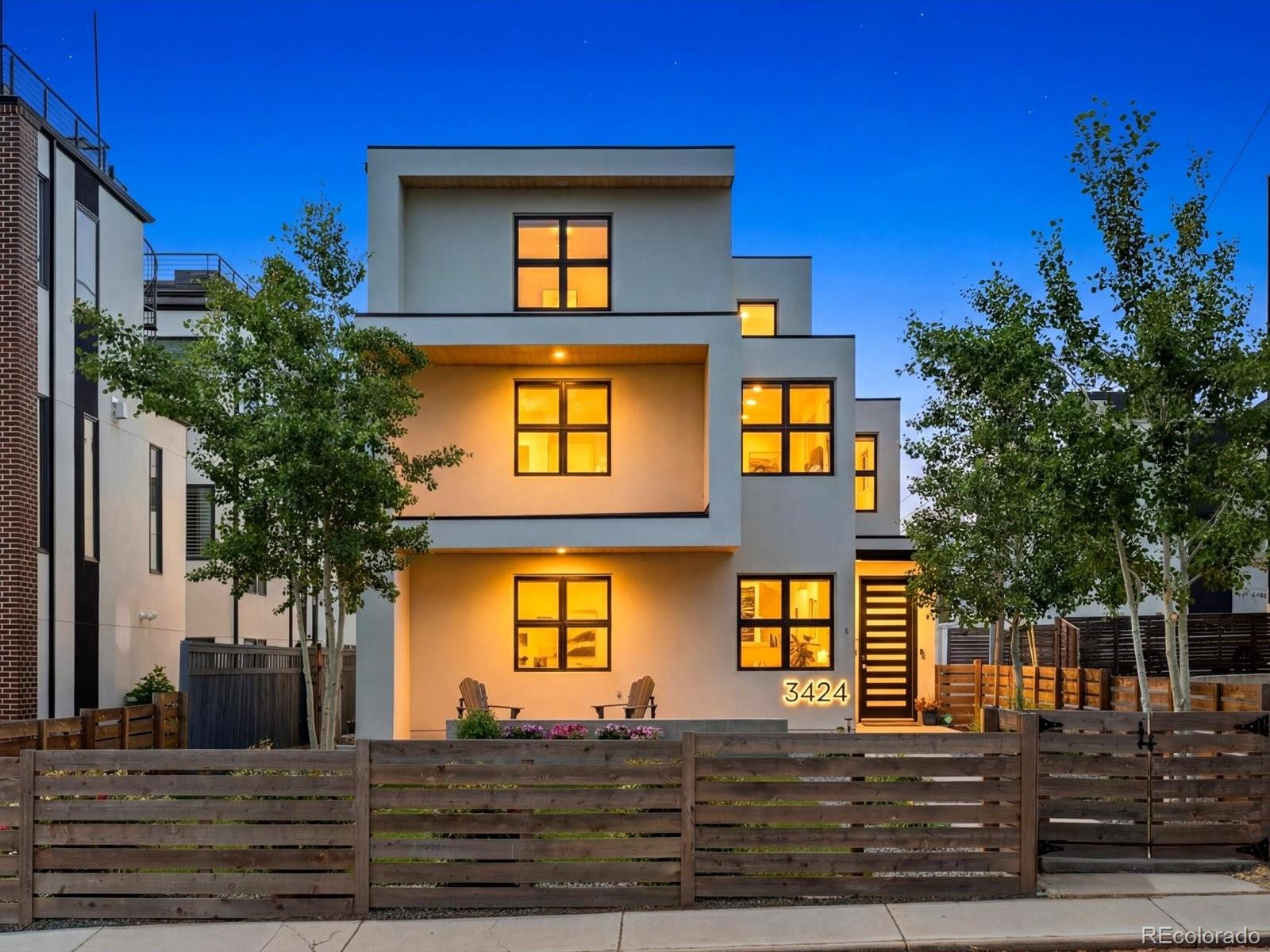 Opportunities like this are exceptionally rare. In a neighborhood increasingly dominated by townhomes and condos, this detached, modern, single-family home offers the space, privacy, and outdoor living that are becoming harder to find near coveted Sloan’s Lake.Situated just one block from Sloan’s Lake, the property features beautifully landscaped front and back yards shaded by mature trees and lush plantings, creating a private urban retreat. Gather around the built-in gas fire pit in the front yard or enjoy Colorado’s incredible weather from one of two oversized decks. The private primary suite deck provides a peaceful escape, while the massive third-floor deck offers an ideal setting for entertaining, dining, and taking in the neighborhood atmosphere.Inside, the home showcases natural hardwood floors, high-end finishes, and a thoughtfully designed layout that blends luxury with everyday comfort. A spacious main-floor office with an attached bathroom provides an ideal work-from-home setup or flexible guest space. The chef’s kitchen features premium appliances, generous counter space, and an open design that flows seamlessly into the main living and dining areas, creating an ideal environment for entertaining and gathering. Large windows and direct access to the outdoor living spaces further enhance the home’s bright, open feel.One of the home’s most valuable and unique features is its rare three-car garage, providing abundant storage and parking. Even more uncommon for the area, the home sits directly across from a school, creating significantly more available street parking than most nearby properties.Enjoy an unbeatable location with Sloan’s Lake, local restaurants, coffee shops, and parks just steps away, while also being within walking distance of Mile High Stadium for Broncos games, concerts, and major events.