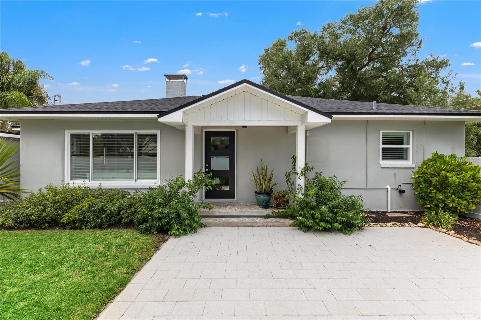 Welcome to this beautifully updated block home in the heart of Magnolia Heights, one of St. Pete's most beloved and walkable neighborhoods. This immaculate 2-bedroom, 1.5-bath home offers 1,074 square feet of light-filled living space plus a detached 1-car garage, situated on a corner lot with extra privacy and parking. The major-ticket items are already done: windows, plumbing, and electrical were all updated in 2022, with a newer roof (2018) rounding out a home that's truly move-in ready. Inside, enjoy an updated kitchen, a thoughtfully added half bath and laundry closet, and updated bathrooms throughout. Outside, manicured landscaping, a paver patio and walkways, irrigation, and a fenced yard create the perfect space to relax or entertain — with room for a future pool or guest suite. The detached garage also offers strong potential for an ADU conversion, ideal for rental income, a home office, or multigenerational living. Just as important: this home sits outside flood and evacuation zones, offering real peace of mind in today's market. And the location is hard to beat — 6 minutes to Downtown St. Pete, every shop and restaurant you need minutes away on 4th St or MLK, 20 minutes to Tampa International Airport, and just 25 minutes to some of the best beaches in the world. A rare chance to own a truly updated home in one of St. Pete's most sought-after neighborhoods!