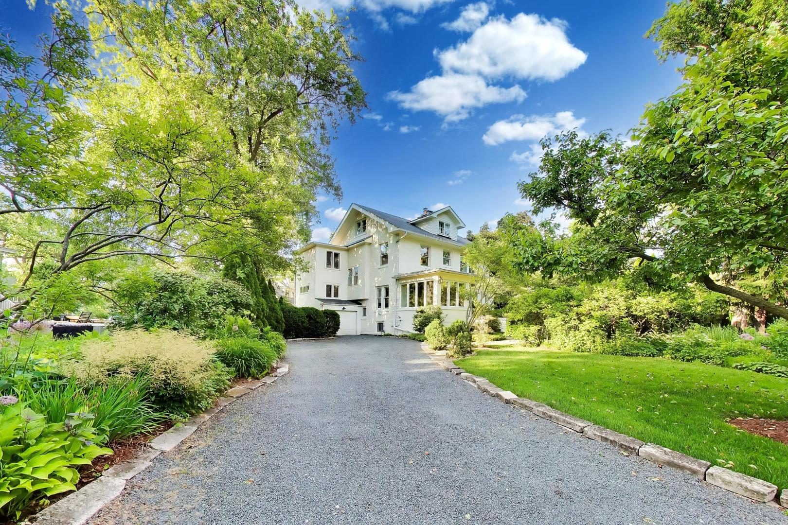 Designer-owned serene East Kenilworth home in an idyllic setting. Filled with timeless vintage charm and beautiful architectural details. Sun-drenched, spacious rooms and large windows throughout. A welcoming south-facing three-season porch opens to a grand foyer, leading to a gracious living room with a wood-burning fireplace. Flexible living spaces include an eat-in kitchen, dining room, den, and charming office.  Upstairs offers four bedrooms, two Jack and Jill baths, including a primary suite with sitting room and decorative fireplace. The third floor provides endless possibilities as a studio, office, au pair suite, or future primary retreat. Enjoy a private brick paver patio and a home surrounded by mature perennial gardens. Ideally located in coveted East Kenilworth, just moments from Homer's, Joseph Sears School, Metra, and the beach-this exceptional home is a rare offering in one of the North Shore's most sought-after neighborhoods.