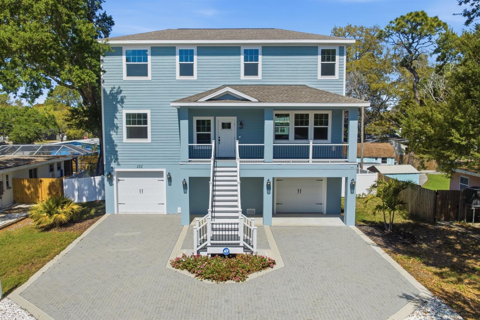 Built in 2023, this elevated home blends modern construction with timeless coastal charm, offering 4 bedrooms, 2.5 bathrooms, and 2,340 heated square feet of thoughtfully designed living space. Situated on a 75' x 120' lot, located in unincorporated Pinellas County, you'll enjoy the benefits of no HOA restrictions with the freedom and plenty of room to bring your boat, RV, golf cart, pets, and all of your toys. The ground level is designed for convenience with two garage bays plus additional space for a golf cart, bikes, paddleboards, fishing gear, jet skis, and a keyed storage closet for added security of tools. A welcoming staircase leads to the 196 sq ft covered front porch and the elevated main living level. The open-concept layout connects the living and dining areas to a beautiful kitchen. The kitchen stands out with quartz countertops, Frigidaire stainless steel appliances, convection oven and microwave wall combo, sleek vent hood, center island with counter height seating, closet pantry, and coffee nook. The spacious dining and living room allow easy access to first and third levels along with a half bath and additional hall storage closet. The primary suite is conveniently tucked away just off the main living area, offering privacy and comfort. This retreat offers 2 closets and an ensuite bathroom with a double sink vanity, glass framed walk-in shower, soaking garden tub, and water closet with linen closet. A carpeted staircase leads to a versatile loft space ideal as a second living area for workspace, playroom, or reading nook, alongside three guest bedrooms, and a well-appointed full bath with dual sink vanity and walk-in shower.  The upstairs laundry room is complete with laundry countertop, storage cabinets, and outfitted for the option of front or top load washer and dryer. Just off the garages, a central hallway connects to a 279 square foot covered patio. The backyard’s size and configuration offer the flexibility to bring your vision to life: whether it’s a sparkling pool, lush vegetable garden, or the ultimate outdoor entertainment space, the possibilities are endless! Cruise your golf cart to sunset views at Live Oak Park, bike the nearby Pinellas Trail, or spend the day at Honeymoon Island State Park. With short-term rentals allowed, this home offers flexibility as a primary residence, vacation getaway, or investment opportunity. Conveniently located to grocery, dining, Ozona, Downtown Palm Harbor, St. Joseph Sound, Sutherland Bayou Boat Ramp, top-rated schools, Dunedin Causeway, & Honeymoon Island State Park. Crystal Beach invites you to slow down, unwind, and truly enjoy coastal living. This is your opportunity to make one of Pinellas County’s most charming communities your home!