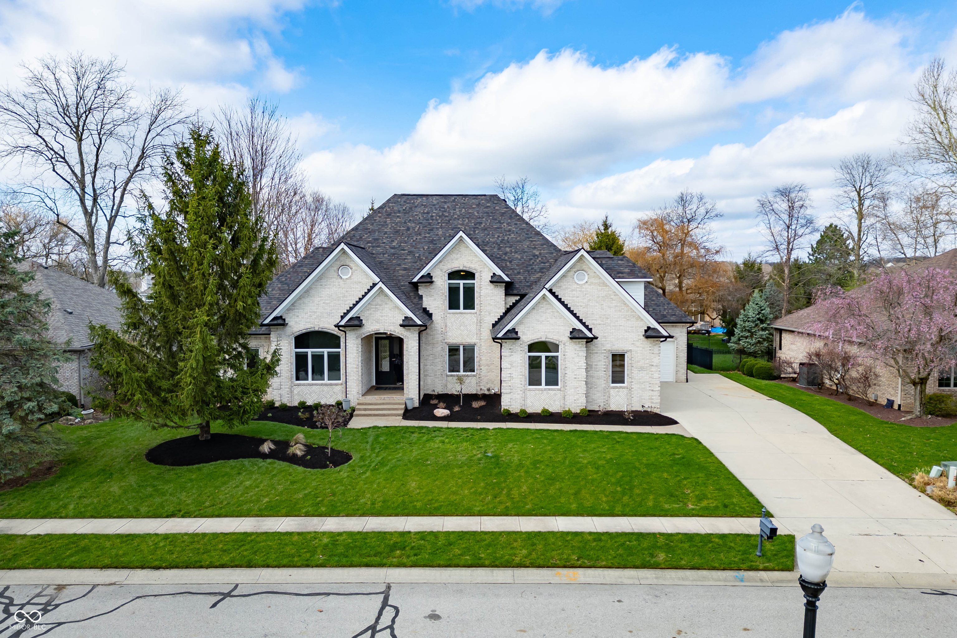An exceptional opportunity awaits! This luxurious, completely updated masterpiece is truly the closest thing to new construction you'll find every square inch of this home is brand new, showcasing the finest craftsmanship and high-end finishes imaginable.  Step inside to a grand living room that exudes elegance and space, highlighted by a vaulted ceiling, stunning tray and coffered architectural details, and a dramatic floor-to-ceiling fireplace flanked by custom built-ins and refined crown molding.  The gourmet kitchen is a dream come true for any chef, appointed with dual steam ovens, refrigerated drawers, a Thermador built-in coffee maker, and hidden behind a discreet doorway a secret butler's pantry designed for both function and elegance.  Upstairs, you'll find four beautifully appointed bedrooms, providing comfort and sophistication for family or guests. The finished basement offers the perfect setting for cozy family evenings or lively gatherings, blending style with livability. Did I mention the immaculate home office? Never a reason to leave this incredible place!  Nestled on a desirable golf course, this home also provides access to a community pool and an amazing on-site restaurant, bringing resort-style living right to your doorstep.  This home must be experienced in person to truly understand its exceptional quality and design a rare find that defines luxury living.