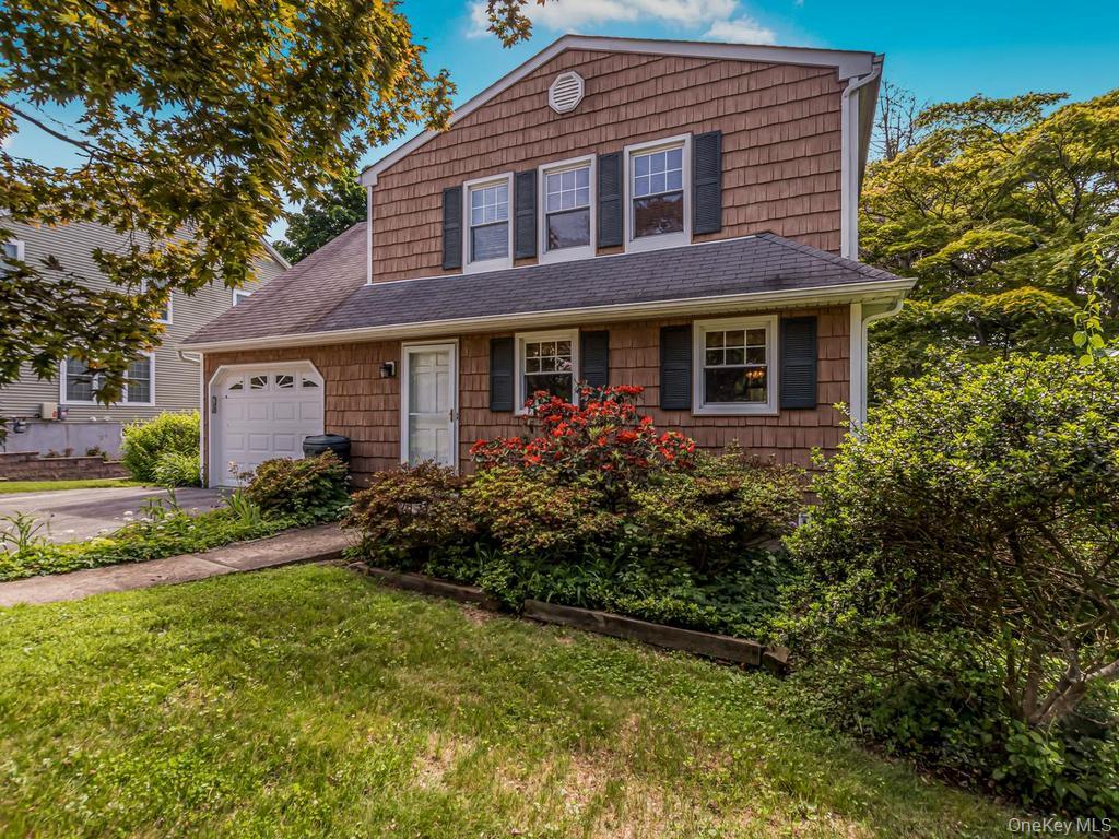 Desirable 4 bedroom Colonial situated on a flat corner lot in a lovely neighborhood in Hawthorne, Westchester County.Upon entering you are welcomed by an entry hall leading to a bright living room and formal dining room with a ceiling fan. The large eat-in-kitchen features a pantry with convenient slide-out drawers, a ceiling fan and a door leading to the welcoming yard.  Off the kitchen is an additional room ideal for a den, office or playroom.  This sun-filled home offers abundant natural light through its many windows. The second floor features a primary bedroom,  hall bath, plus 3 additional bedrooms.  Each window offers views of beautiful mature trees.. Hardwood floors through out. The fenced in yard is truly enchanting, featuring lovely plantings, garden areas, and benches for relaxing and entertaining.  The property extends beyond the fenced yard all the way to the corner.   Enjoy summer close to home with the option to purchase membership to the local community pool, providing a resort-like setting for summer recreation and enjoyment for all ages.Additional features include an unfinished basement with high ceilings, washer and dryer, hot water heater, and Burnham furnace.  The driveway easily accommodates up to five cars. Vinyl siding updated 2018 and back yard fence in 2020 and updated garage door. For those who qualify star exemption is $1280.33.This home is conveniently located to all major highways, metro north train station, schools and shops.