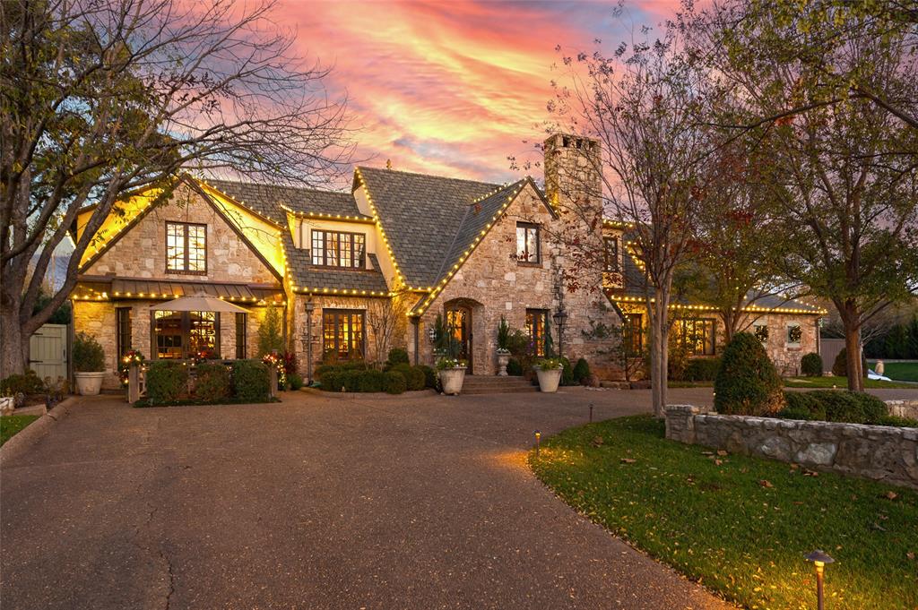 A December Evening at Avondale: The sun dips low over Nichols Hills, casting a soft winter glow across the corner of Avondale Drive and Belford Avenue. The lights along the roofline flicker to life, warm and golden, outlining a home that feels like it was built for this very season.You pull into the drive, and before you even step inside, you can hear laughter drifting from somewhere in the house— negotiating whether it’s too early for s’mores, someone queuing up holiday music, the soft clinking of glasses being set out for the evening. The front door opens to the comforting scent of a wood-burning fireplace, and the kind of quiet luxury that doesn’t try too hard… it just is.Inside, the rooms unfold one after another: glowing, inviting, layered with textures of stone, wood, and warmth. Friends gather around the kitchen island, oversized stockings hang near one of the fireplaces, and the French doors along the back showcase a courtyard ready for winter nights wrapped in blankets and stories.You wander outside for a moment, where the patio lights sparkle against the stonework. Someone has already set out the marshmallows, and there’s a throw blanket folded over the arm of a chair with your name all over it. The kind of simple comfort that feels rare now. The kind you want to hold onto.And standing there, half an acre of privacy around you, the house glowing behind you, you realize something:This isn’t just where holidays happen. This is where they become tradition.Welcome to 6638 Avondale Drive. Where every December evening feels like a memory you’ve somehow known your whole life.