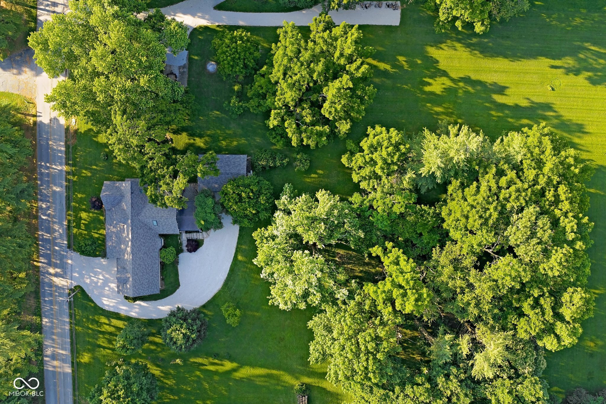 Total 7.7 acres. Near Indiana University | Downtown Bloomington | IU Health Bloomington Hospital | Crane Naval Base commute | Indianapolis commute | Easy I-69 access.  Full property offering home + acreage with flexibility for future use, privacy, and expansion.  Property is being offered in multiple configurations:  * Full 7.7-acre property (this listing)  * Home on approximately 2.7 acres  * Separate 5+/- acre buildable parcel  Subdivision in progress. Final acreage, boundaries, and parcel numbers to be determined prior to closing. Opportunity to secure the full property before division-offering the best overall value per acre. Cross-listed with BLC # 22046872  (full 2.7+/- and house) and BLC # 22056213 (5+/- acre land only). Seller will only accept one offer across all configurations. Listing availability must be confirmed prior to submitting an offer. Public sewer is available on-site, offering added flexibility for future use, subject to city approval.