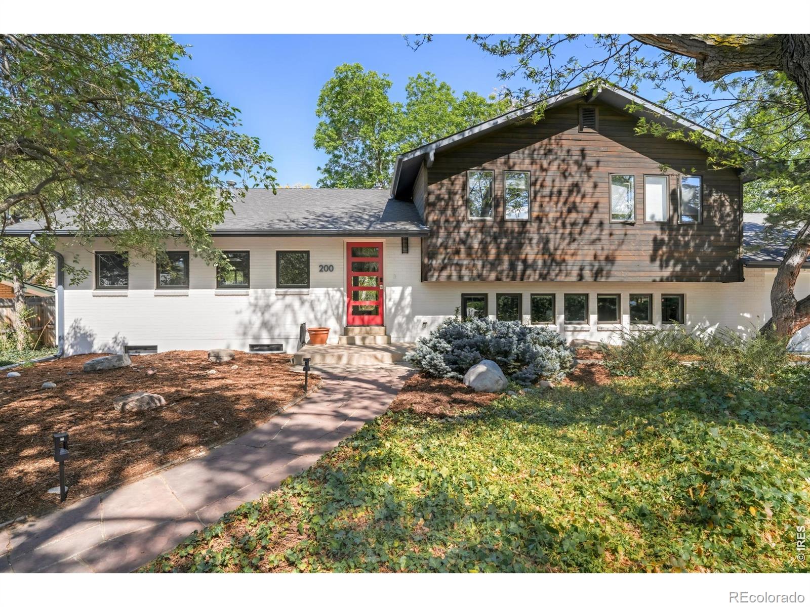 This exceptional Fraiser Meadows residence sits on a rare, expansive, and flat one-third acre lot - a rare offering in Boulder at any price. Inside, impeccably refinished hardwood floors flow throughout an open-concept floor plan where the kitchen, dining, and living spaces connect naturally. The kitchen shines with top-of-the-line stainless appliances, a professional range, and Silestone countertops. Three updated bathrooms, a custom gym with built-in storage, Nest detectors, and a Breezair cooler round out a home that's been genuinely cared for and upgraded throughout. Even amongst a long list of thoughtful updates, perhaps the most compelling feature of the property is its remarkable backyard escape. The in-ground trampoline and beautifully remodeled backyard make this a dream for outdoor recreation, while the $50K yard transformation, lawn irrigation, new sump pump, and sewer main line mean the big-ticket items are already done. Nestled moments from Horizons School, with views of the mountains and the kind of yard that sets the stage for making memories - this home is defined by how well it lives, both inside and out.