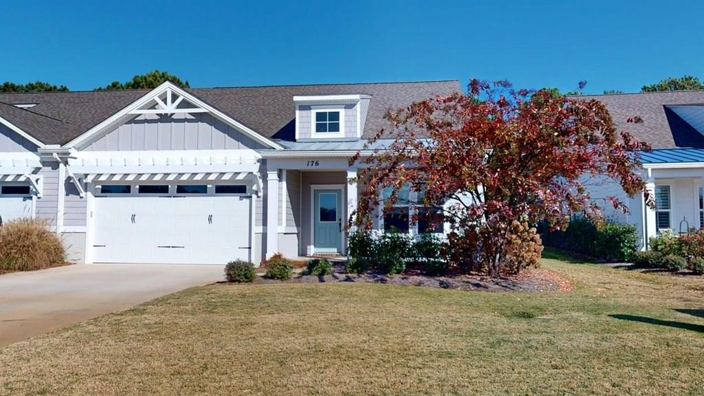 Picture yourself in Palmer Lake Villas. Built in 2021 by esteemed home builder Beacon Custom Homes. Very low maintenance property with very high value! 3 bedrooms 2 full bath on lower level and one bedroom one full bath upstairs. Well appointed live-in kitchen with high end appliances. Living room has fireplace with gas logs and abundant natural light. The kitchen and living space give way to a large 3 piece sliding glass door. This door opens to a screened in rear patio with clear views of the golf course and pond. You can enjoy privacy and serenity here, yet very close to the club amenities, beach and the historic town of Cape Charles. 50 minutes from Norfolk International Airport. ***Be sure to check out the virtual walk through and exterior 360 views!