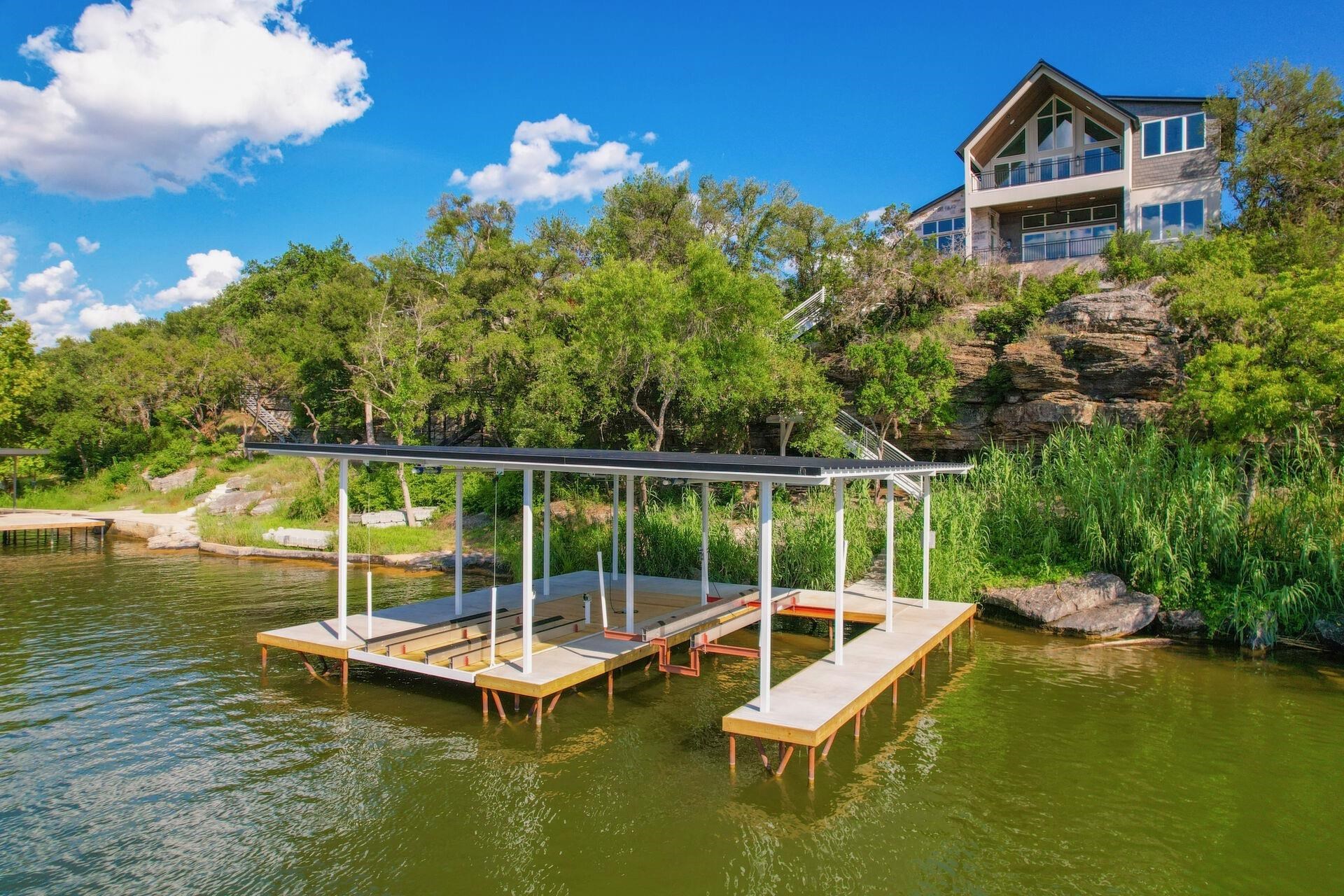 **HUGE PRICE DROP ** Lake Marble Falls Waterfront ! Located at 116 Los Escondidos, Marble Falls, this brand-new (Keith Wing) custom build waterfront home offers 4 bedrooms and 5 1/2 baths, featuring 4,300 square feet providing ample space for both relaxation and entertainment.  Large Patio Doors lead to a backyard that overlooks your private pool area with scenic views of Lake Marble Falls. Stairs lead down to the waterfront / beach area with private boat and jet ski dock  Host a summer BBQ, lounge by the pool, take the boat out for afternoon of wakeboarding and sight seeing... then stroll over to downtown Marble Falls for a Hill Country evening of entertainment. Enjoy anything from a casual dinner downtown to various shops and cultural attractions Marble Falls has to round up your day.  A Lakefront Home in the Texas Hill Country & "close in" to downtown? That's about as good as it gets isn't it? Don’t miss the chance to claim this slice of paradise as your own. Perfect for those looking for a full-time residence or a luxurious part-time getaway. Welcome to your new lakefront retreat at Lake Marble Falls!  (Additionally new construction just completed at 112 Los Escondidos and also available for sale)