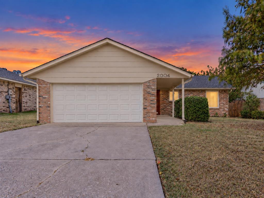 Welcome to 2004 Oak Forest! This exceptionally well-maintained, move-in-ready home offers an unbeatable combination of comfort, functional living, and vibrant community amenities. Situated in a peaceful and established neighborhood, the property gives you immediate access to the edition's neighborhood park and scenic walking trails, making morning walks and outdoor recreation effortless.From the moment you step inside, true pride of ownership is evident throughout the home. Every area has been meticulously cared for, creating a warm and inviting atmosphere that is completely ready for its next owner. Beyond the interior charm, the home provides exceptional peace of mind with an in-ground storm cellar conveniently located inside the garage area, ensuring quick and secure shelter during severe weather.One of the standout features of this property is its remarkably versatile layout. The original two-car garage space has been thoughtfully repurposed to maximize usability. One side retains traditional garage shelter and storage, while the other side has been converted into a fully insulated, climate-controlled walk-in room. Equipped with its own dedicated heating and air conditioning window unit, this finished addition is limited only by your imagination. It serves as the ideal setup for a quiet home office, private exercise studio, crafting space, workshop, game room, or specialized climate-controlled storage.Combining a highly desirable location, excellent upkeep, safety features, and customized flexibility, this home truly stands apart. Whether you are looking to enjoy quiet evenings near the neighborhood park or utilize a property that accommodates your unique hobbies and lifestyle needs, 2004 Oak Forest delivers on every level. Schedule your private tour today to experience everything this wonderful property has to offer!
