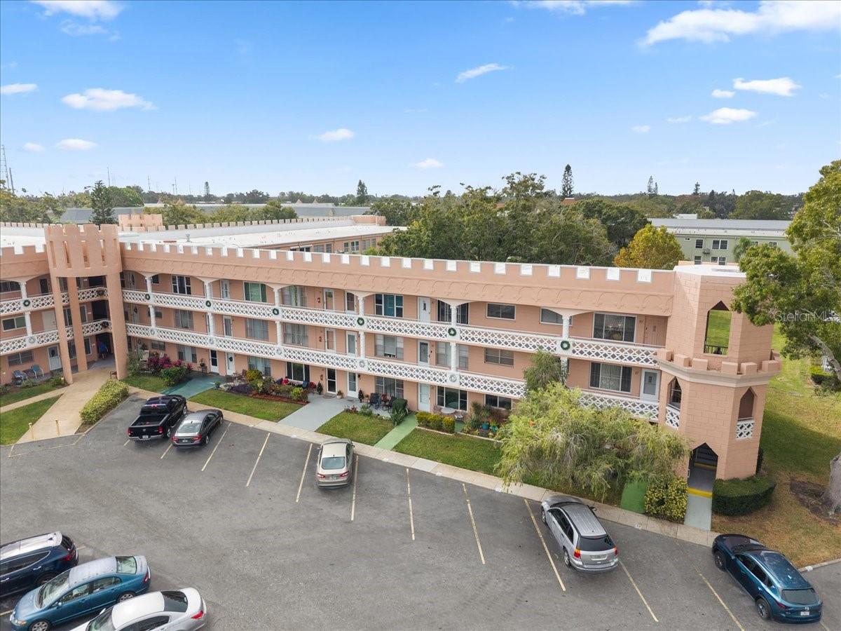 Discover the perfect blend of coastal living and everyday convenience in this charming 2-bedroom, 2-bathroom condo offering 1,100 sq. ft. of bright, comfortable living space. Situated on the main floor with dedicated parking directly outside the front door, this condo provides effortless access. Located in On Top of the World, a wonderful 55+ community with amenities galore! From pools & a fitness center to social & activity groups, 18 & 9 hole golf course - to name a few, this community has it all. Centrally located just minutes from world-famous Clearwater Beaches, this home places you close to everything – the shops and eateries of Dunedin, the vibrant & local downtown in Safety Harbor, and short drives to everything Tampa and St. Pete have to offer. Step inside to find an inviting open layout with large windows that fill the home with natural light. The spacious living and dining areas flow seamlessly, making it ideal for relaxing or entertaining. The kitchen offers abundant cabinet space that extends into the dining area and overlooks the main living room, providing easy flow for hosting and ample storage throughout. Both bedrooms are generously sized, with the primary suite offering an en-suite bathroom. The second bedroom is perfect for guests, a home office, or a seasonal retreat. Enjoy two outdoor patios—one in the front and one in the back—perfect for sipping your morning coffee, unwinding in the fresh air, or enjoying peaceful Florida evenings. Schedule the tour of your new home today!