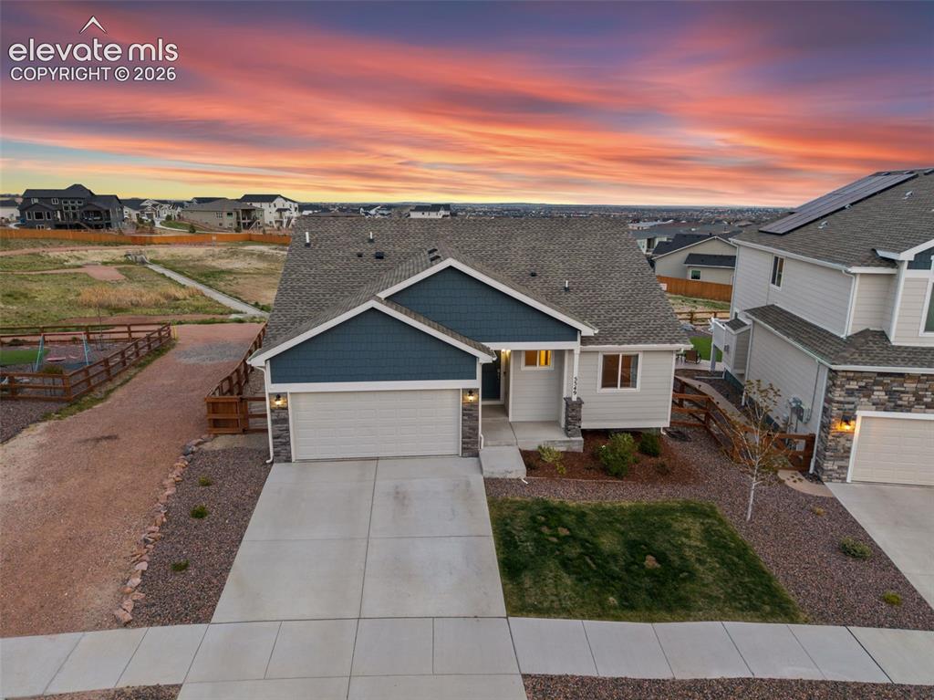 Welcome to this beautifully designed ranch-style home in the desirable Bradley Ranch subdivision, built in 2021 and thoughtfully crafted for modern main-level living. Offering 5 bedrooms, 3 bathrooms, and a functional open floorplan, this home combines comfort, style, and convenience throughout.The main level features 3 spacious bedrooms, including a private primary suite with an adjoining bathroom, along with an inviting living area and well-appointed kitchen complete with stainless steel appliances. The finished walk-out basement expands your living space with a large rec room perfect for entertaining, movie nights, game days, or a home gym setup, plus 2 additional bedrooms and a full bathroom—ideal for guests, teens, or multigenerational living. Step outside to enjoy the fully fenced backyard featuring low-maintenance turf and an expansive composite deck—perfect for relaxing, hosting gatherings, or enjoying Colorado evenings. Additional highlights include a 2-car garage, solar panels for added energy efficiency, central air conditioning and the peace of mind of a pre-inspected home. This move-in ready property offers the perfect blend of modern finishes, practical living spaces, and outdoor enjoyment in a sought-after neighborhood.