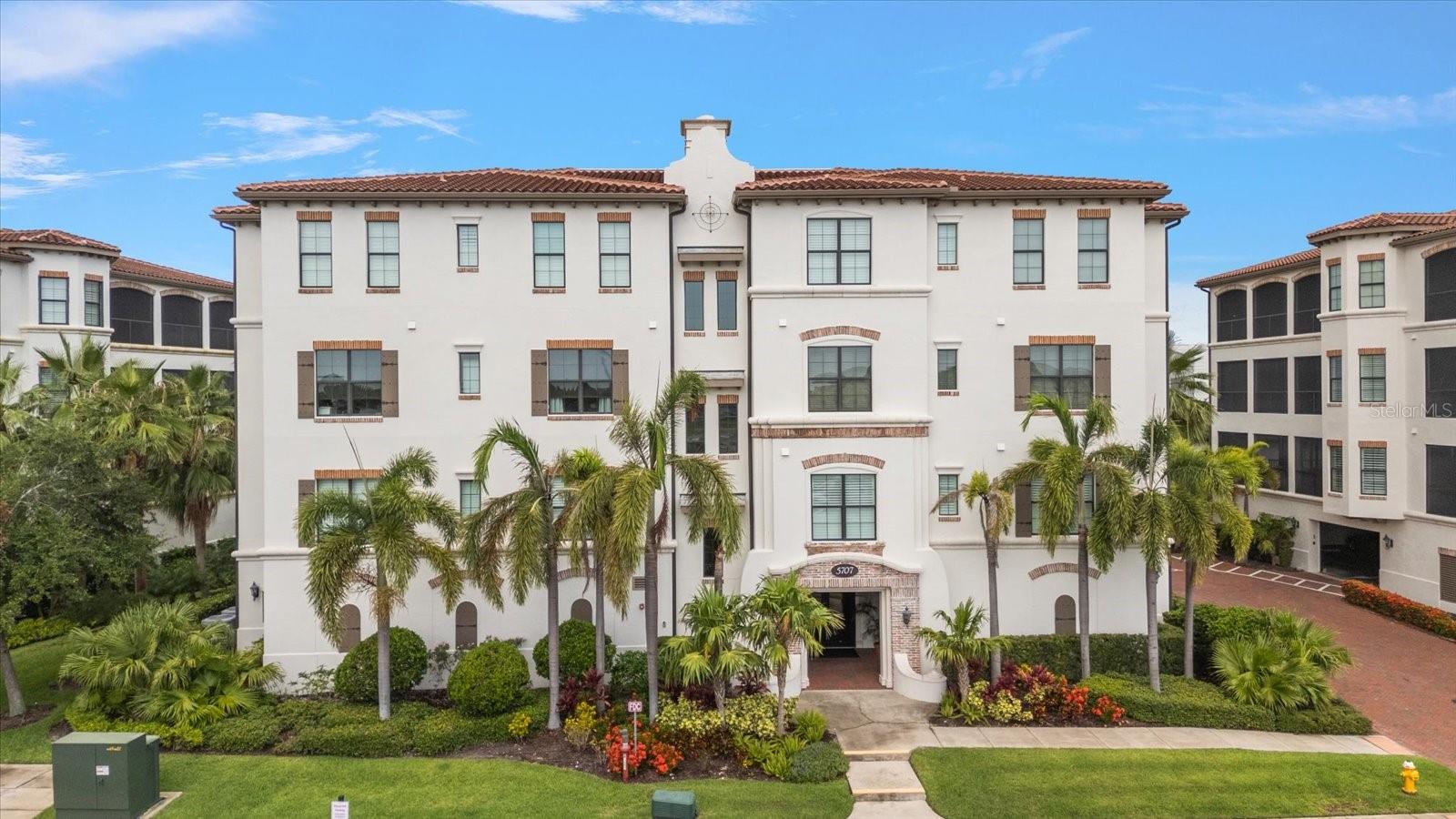 Under contract-accepting backup offers. Welcome to Casa Bahia – South Tampa’s Waterfront Masterpiece Experience of elevated coastal living in one of Tampa’s most exclusive hidden gems at Westshore Yacht Club. This beautifully appointed 4th floor waterfront residence offers breathtaking panoramic views including both Downtown Tampa and Downtown St. Petersburg, private elevator access, and maintenance-free luxury. As you step off your private elevator, you are immediately greeted by an expansive, west-facing open floor plan, where sweeping views of Old Tampa Bay flood the space with natural light. Beautiful engineered hardwood floors flow through the main living areas of this immaculate home. This move-in-ready unit blends modern elegance with timeless coastal charm. This home features 10-foot tray ceilings, large pocket sliding doors, and an abundance of natural light coming in from the gorgeous open bay views. It also features Savant expandable home automation system that controls AV in the house as well as lights and the Atmos system in the living room. The spacious living room also features a wall-mounted Smart TV, remote controlled blinds and direct access to the oversized lanai. Perfect for entertaining or unwinding with a stunning sunset. The Gourmet kitchen features soft-close wood cabinetry, stunning granite countertops and backsplash, gas cook top, range hood, microwave, convection oven and Kitchen Aid stainless steel appliances including an amazing U-line ice maker. The dining area includes a stylish dry bar with dual Whirlpool wine and beverage coolers which is ideal for casual dining or cocktail hour. The wraparound lanai is true Resort-Style Outdoor Living with 700 square feet of space that gives you incredible eastern and western views. Remote controlled hurricane shutters have also been installed (2025) on the outside for added peace of mind. The oversized primary suite offers serene water views, a tray ceiling, and large sliders out to the expansive lanai. The luxurious ensuite bathroom includes dual vanities, a tranquil garden tub, a glass-enclosed large walk-in shower, and a huge walk-in closet with an organization system built in.  So many wonderful features throughout this home also include the split floor plan that offers separation and privacy from the 2 additional ensuite bedrooms. There are closet systems in every walk-in closet, a den/library/media room with gorgeous built-in shelving and cabinetry, tankless gas water heater (2023), a large laundry room with solid counters and cabinetry. Also, a convenient garbage chute and this unit includes the one of the largest storage spaces and the largest parking spaces (2.5 spaces) in Casa Bahia. The parking spaces are immediately adjacent to the storage unit which is extra convenient. Come be a part of a true waterfront lifestyle. This home is located within the guard-gated Westshore Yacht Club. Residents enjoy unmatched amenities such as a 149-slip deepwater marina, two heated pools with towel service, tiki bar, a 24-hour fitness center, spa services, fine dining, and 806 Lounge at the Bay Club. There are also weekly social events, a community dog park, playground and easy access to Gulf beaches, Downtown St. Pete, Downtown Tampa and Tampa International Airport. Embrace the elegance, security, and serenity of true coastal living. Schedule your private tour of this rare waterfront treasure today.