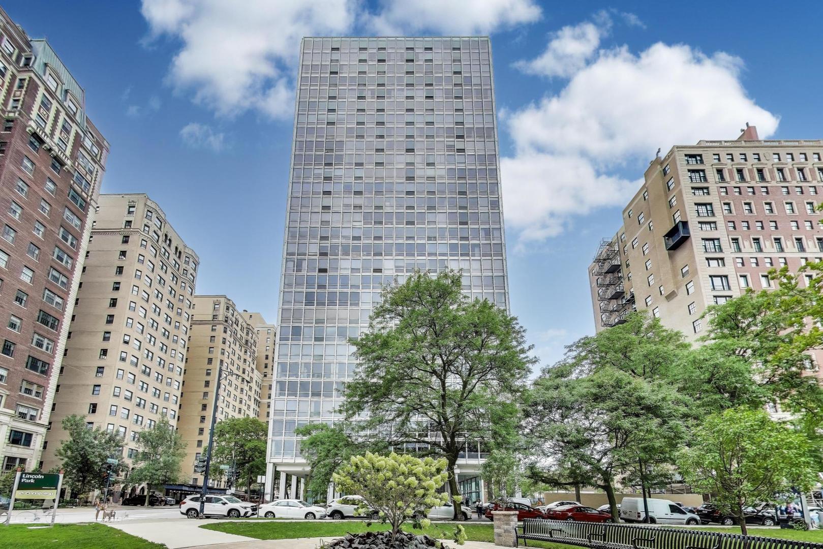 Rarely available (08 tier) high-floor 2 bedroom/2 bath at the iconic 2400 N Lakeview - a Mies van der Rohe mid-century gem in the heart of Lincoln Park! Incredible opportunity with approved SHORT SALE and a blank canvas to design your dream home. Lovingly maintained by the original owner for 52 years, this residence has never before been offered for sale. This sun-filled corner unit showcases sweeping park, lake, and sunset views to the north and west - stunning at all times of day and night. One of the building's larger 2-bedroom floor plans, the home features a gracious foyer entry, open living and dining room framing postcard-worthy views, and a tucked-away kitchen with excellent function and endless potential. The spacious primary suite is flanked with walls of windows, generous closets, and ensuite bath. A sizable second bedroom offers flexibility for guests, office, or den. Solid, well-managed elevator building with professional staff, outdoor pool & grill area, on-site maintenance, and laundry. Unbeatable Lincoln Park location: steps to the lakefront, trails, zoo, farmer's market, cafes, transit, and top schools (Lincoln Elementary & Lincoln Park HS). An exceptional chance to create your own modernist retreat with true postcard views - sold in AS IS condition.