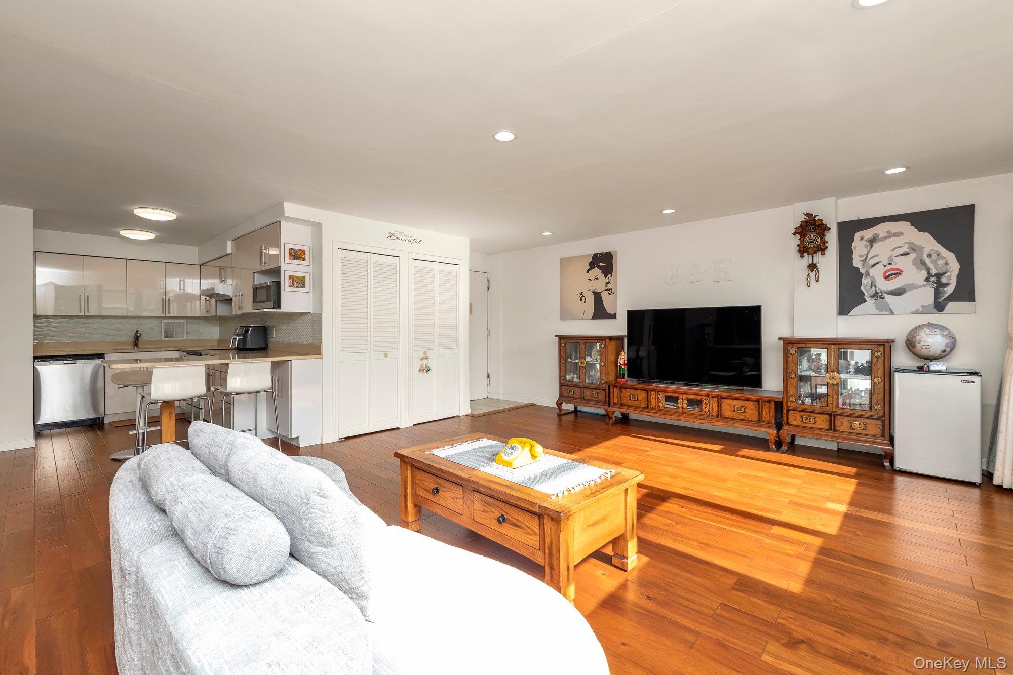 Move right into this eastern exposure with panoramic reviews.Sleek manhattan style apartment, sundrenched with wall of windows in living room and dining room.  Custom window drapes.  Flat ceiling.  Hardwood flooring throughout.  Custom new expanded kitchen with lacquer white cabinets.  Stainless steel appliances with granite countertops.  Stunning state of the art bath with walk in shower.  Enclosed terrace for year round enjoyment with two entrances from the dining room and master bedroom.  Prime parking space available for transfer.  Lehavre offers 3 tennis courts, gym, clubhouse, outdoor swimming pools and cafe.