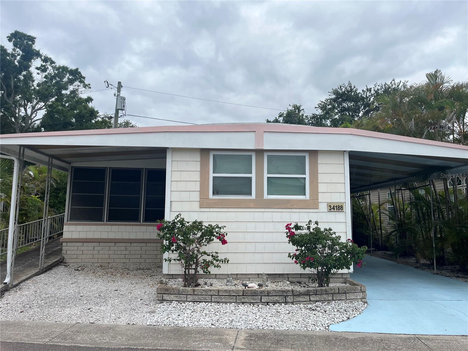Affordable Florida Living in Sunset Palms – 55+ Co-Op Community.Welcome to this charming 2-bedroom, 1-bath mobile home located in the desirable Sunset Palms 55+ community. Situated along a peaceful drainage canal, this home offers a relaxing setting and plenty of outdoor space to enjoy Florida’s beautiful weather.  Inside, you’ll find a comfortable floor plan plus a spacious Florida room, perfect for entertaining, hobbies, or additional living space. The property features a covered two-car carport with an additional parking area ideal for a golf cart. Residents of Sunset Palms enjoy an active lifestyle with an impressive selection of community amenities, including a clubhouse, pool, spa/hot tub, recreation facilities, shuffleboard courts, laundry facilities, and a variety of daily social activities and events. Conveniently located near I-275, shopping, restaurants, and Florida’s beautiful Gulf beaches, this home offers easy access to everything the area has to enjoy. Don’t miss your chance to own a piece of paradise in Sunset Palms—schedule your private showing today!