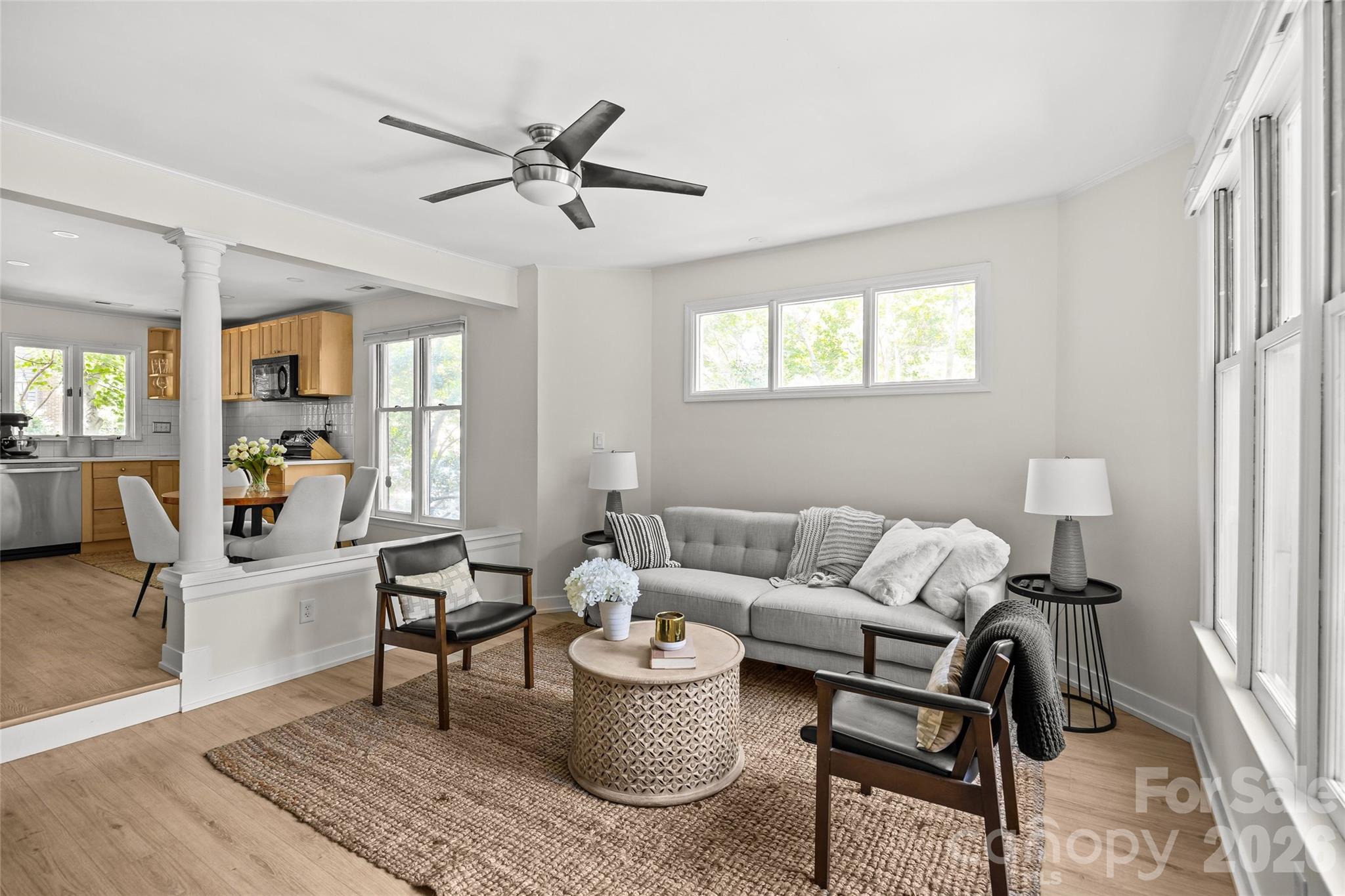 Welcome to 433 W 8th Street, where historic Fourth Ward charm meets modern edge. Thoughtfully reimagined, this Uptown retreat delivers style, substance, and effortless livability. The kitchen steals the show with new crisp quartz countertops paired with a contemporary 4x4 backsplash creating a space that’s chef-worthy and cocktail-ready. The primary suite overlooks the large patio allowing ample natural light to flood the space. The updated bath, with oversized shower tall and vanity with quartz top is polished and sophisticated. The wood burning fireplace anchors the living room which flows seamlessly to the covered porch, setting the stage for morning coffee, evening wine, and gatherings that linger just a little longer. Step outside and Uptown becomes your playground. Fourth Ward Park is just across the street, dinner at Alexander Michael’s is a short stroll away, and Harris Teeter is right where you need it. Add in quick pool access, private in-unit laundry, and a dedicated parking space, and a Myers Park School Assignment and you have a rare Fourth Ward find. 433 W 8th Street isn’t just a home—it’s a lifestyle with attitude.