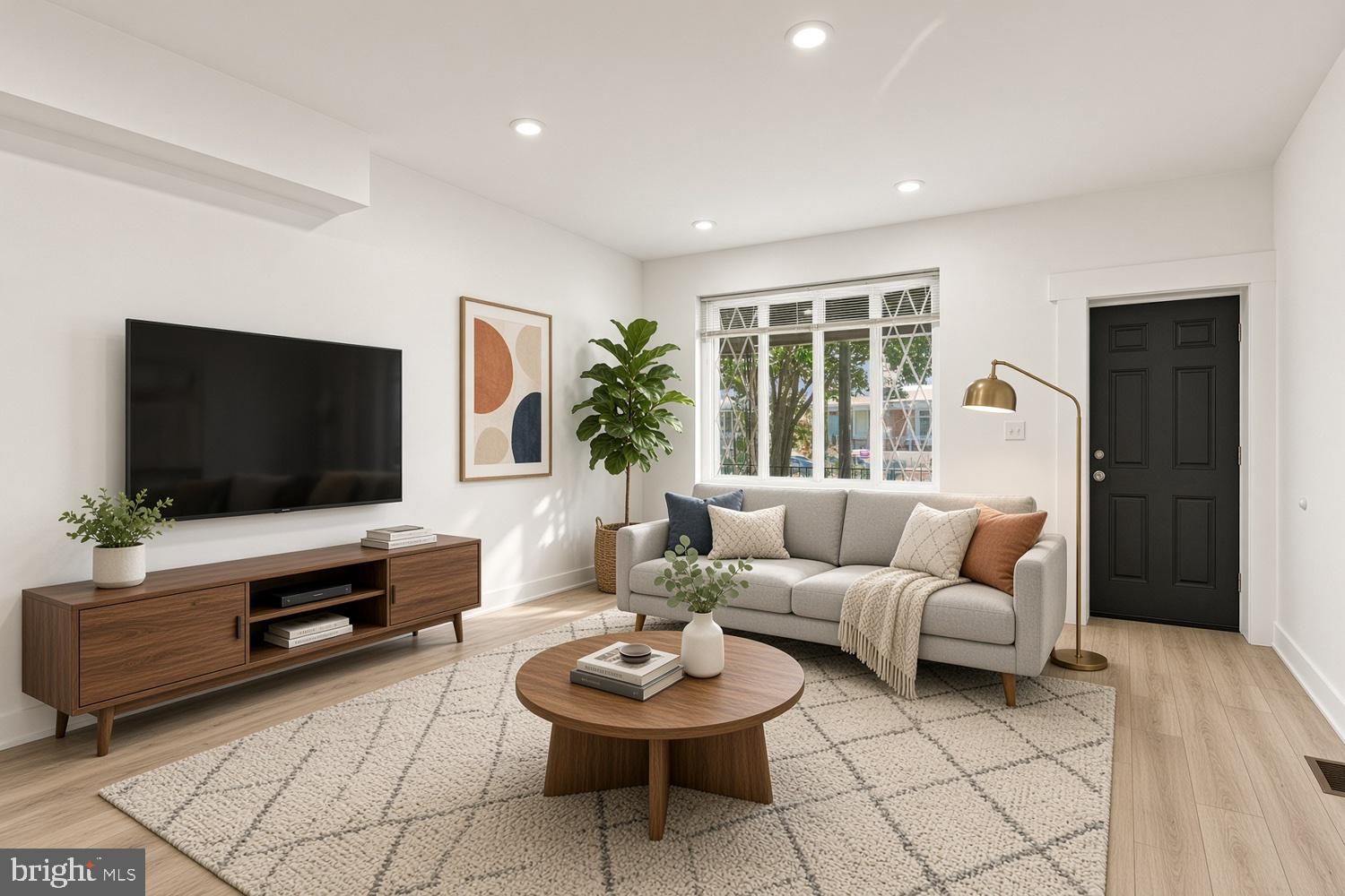Welcome to 807 South 57th Street in Cobbs Creek — fully renovated just one year ago. As you walk up, you're greeted by a large front porch and front yard, and a good-sized backyard completes the picture. Step inside and the open floor plan flows from the living room into the kitchen, with a bedroom in the back on the first floor as well as a half bath. Upstairs, three more bedrooms and two full baths — the master suite has its own en suite. The large basement with high ceilings is great for storage.