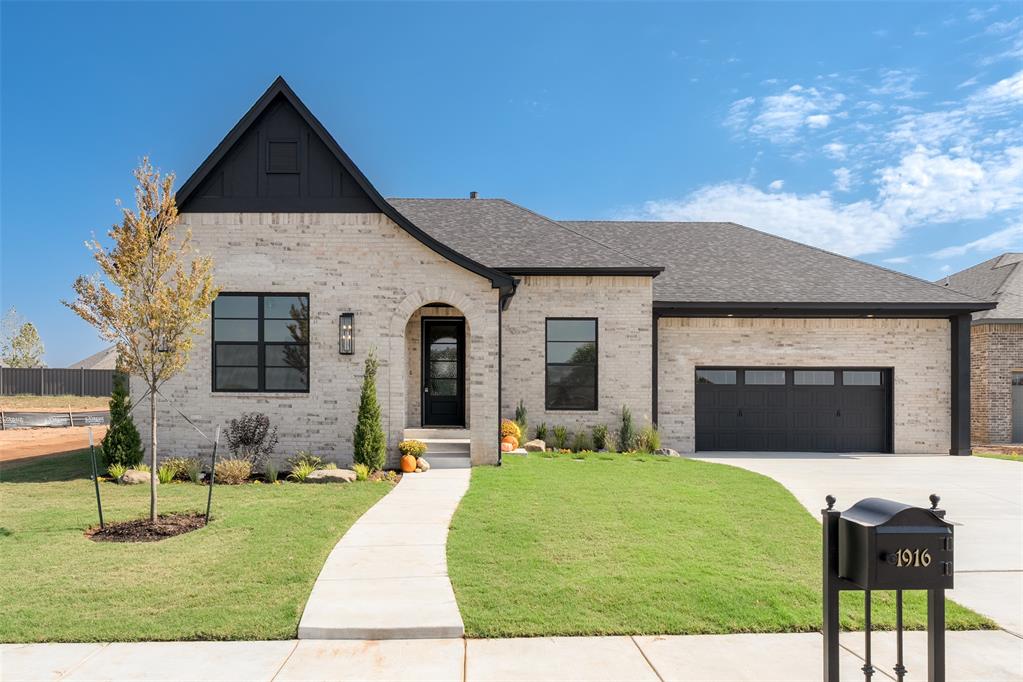 Come explore this move-in ready English Tudor in our charming Keller plan, located in the picturesque Town Square community! This thoughtfully crafted home includes 3 spacious bedrooms, 3 luxurious baths, and a private study off the front of the home with built-ins. The bright and airy open-concept layout seamlessly flows from the gourmet kitchen to the dining area and into the living room, which features a breathtaking stone-to-ceiling corner fireplace and a window wall from the back patio that bathe the living spaces in natural light. The chef’s dream kitchen is equipped with a grand island and buffet cabinet, perfect for culinary adventures. The lavish primary suite offers a relaxing tub, a spa-inspired glass shower, a double vanity, and a remarkably large master closet that will leave you in awe, complete with convenient access to the laundry room. This home is nestled in Edmond’s historically inspired Town Square community. Enjoy the lush greenbelt, serene fishing pond, tranquil floating deck, endless walking trails, community garden and a playground for the little ones! The Town Square Residents Club offers a resort-style pool, a vibrant youth rec center, a modern fitness facility, and a welcoming clubhouse. Our model home is open 7 days a week at 3717 Union Park Place, Edmond, OK 73034.