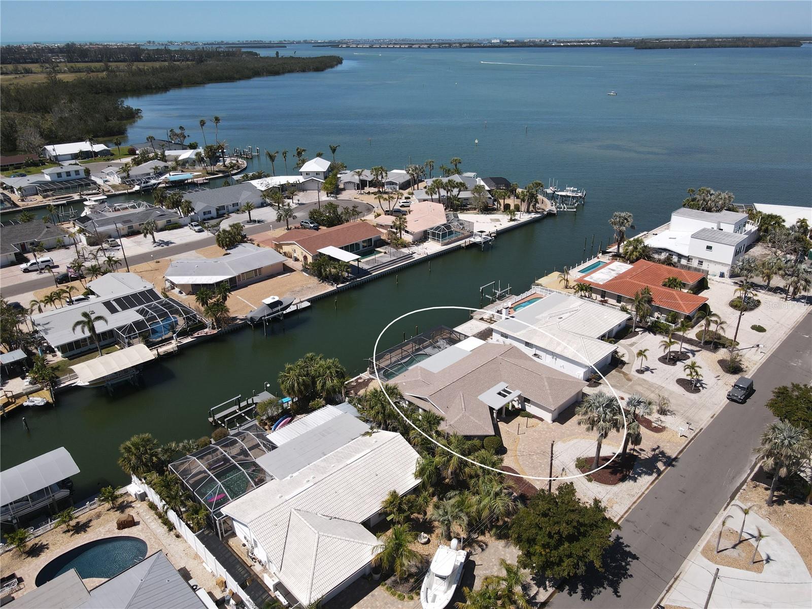 Back on the Market as Buyer Financing Fell Through.  PRICE IMPROVEMENT On Million Dollar Views! Welcome to your waterfront retreat in San Remo Shores, a lovely neighborhood in Bradenton! This Deep Water, Saltwater canal-front home sits near the end of a quiet cul-de-sac, offering quick and easy access to the azure waters of Sarasota Bay and the Gulf of Mexico— with no fixed bridges- a true paradise for boaters and water enthusiasts.
Inside, this well-maintained home features terrazzo floors in the main living areas, a 2024 roof, and 2025 impact multi-slide patio doors, providing both storm protection and a seamless indoor-outdoor flow.  Air Conditioner from 2019. The spacious living room and formal dining room offer plenty of room for relaxation and entertaining. The kitchen is equipped with a 2025 built-in oven, newer dishwasher, and a cozy eat-in area. Additional conveniences include a separate laundry room and a spacious garage for extra storage.
The home boasts a bright and airy Florida room with 2025 luxury vinyl flooring, and a Built In Murphy Bed, offering a comfortable indoor space to enjoy the Bay and Canal views. Outside, a newly refurbished screened outdoor area with 2025 Flat Roof leads to the large in-ground pool, making it perfect for year-round relaxation and entertaining. The dock features 2025 wood treads, adding both safety and style for easy waterfront access.  The 2025 installed pavers along the canal wall enhance both the beauty and functionality of this prime waterfront property.
Voluntary HOA means you can AirBNB, making this home a Great Investment Opportunity! 
While the Florida room did experience minor water intrusion from Hurricane Helene, it has been fully remediated, and no home or flood insurance claims were filed.
Don't miss this opportunity to own a piece of paradise in San Remo, where boating, beaches, and swimming await you. Just minutes from Sarasota Bay and the Gulf of Mexico, and Minutes by Car or Bike to the Beautiful Sandy Beaches of Anna Maria Island! —schedule your showing today!
