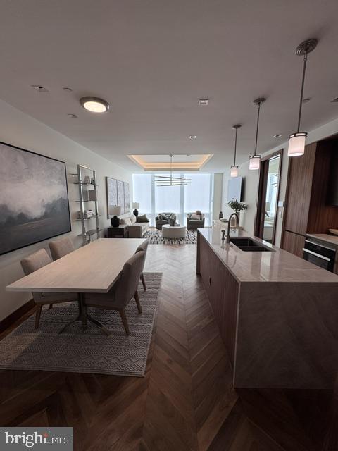 Welcome to the Four Seasons Private Residences in the heart of Harbor East, where luxury, location, and lifestyle converge.  From the 19th floor, this gorgeous 1 bedroom, 1.5-bathroom residence offers spectacular  views of the Inner Harbor and marina and the Baltimore city skyline through  floor-to-ceiling windows.  This refined residence features rich cherry flooring and high-end finishes throughout. The gourmet kitchen is outfitted with elegant cabinetry, a gas cooktop, wall oven, huge island with breakfast bar, and elegant quartz countertops. The adjacent dining area and wet bar with sink and wine fridge are ideal for entertaining or for a quiet night at home.  The primary suite includes a custom walk-in closet and a luxurious marble bathroom with double sinks, a large soaking tub, and separate shower. A second room, also nicely sized, offers comfort and privacy for guests or family.You’ll also enjoy full access to all hotel amenities, including the outdoor pool and valet services. The Four Seasons features four on-site restaurants, and many amazing dining options just a short walk away in Harbor East and Fells Point.  Shopping, parks, harbor activities, museums, and miles scenic waterfront walkways are all close enough to enjoy every day.  Experience luxury living at the Four Seasons, it’s more than a residence, it’s a lifestyle.