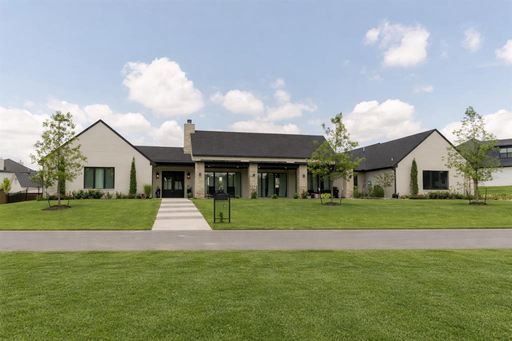 Incredibly GORGEOUS Single Story Home positioned on a fully usable 3/4 acre homesite within gated Edmond community. This newly built residence delivers a rare balance of warmth, scale, and intentional design. Luxurious upgrades throughout, this is a must-see.Inside, the home's foyer opens to a striking main living space defined by soaring 24' vaulted ceilings and anchored by a true wood-burning fireplace. The layout offers both intimacy and functionality, designed to feel comfortable for daily life while effortlessly accommodating gatherings of any scale. The windows in this home are impressive throughout. The kitchen is a statement in both design and performance. Outfitted with premium JennAir appliances, a 48-inch gas range, built-in refrigerator, panel-front dishwasher, marble countertops, and a Ruvati sink with dual faucets, it is complemented by a fully equipped scullery. This secondary space features an additional dishwasher, built-in coffee and espresso system, freezer, microwave, secondary sink, and abundant storage, allowing the main kitchen to remain polished while hosting.Each of the four bedrooms features its own private ensuite, offering a level of privacy and comfort rarely found. A dedicated office or flex space adds versatility, while a thoughtfully placed powder bath is positioned to function as a future pool bath.Outdoor living is equally intentional. Oversized covered front and back patios create shaded extensions of the home designed to be enjoyed year-round. Fully usable and pool and shop accommodating, offering the flexibility to design a true lifestyle property tailored to your vision.Private well system providing significant monthly savings compared to city utilities, storm shelter, water softener, full fencing, and extensive concrete work already in place.Only the Exceptional.