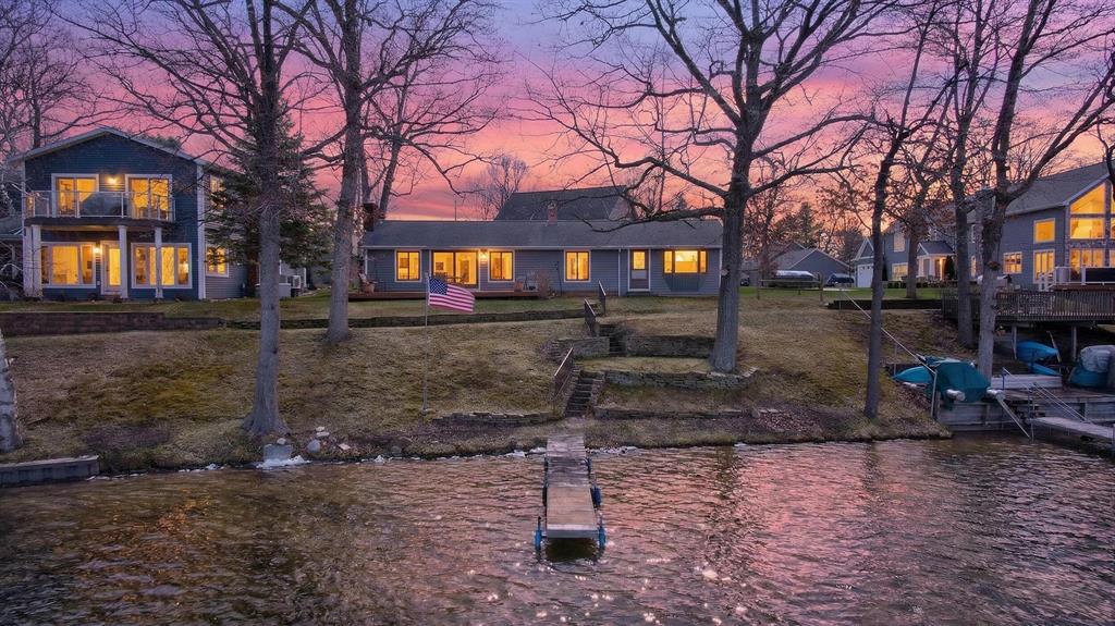 Don't miss this rare opportunity to own waterfront property on prime real estate at Big Wolf Lake. This charming 3 bedroom, 2 bath home is perfect for gathering family and friends, offering stunning lake views that stretch the length of the house so you'll never miss a sunset, whether your tucked inside on winter evenings curled up to the stone fireplace or sipping a beverage on the sprawling deck watching the boaters go by. The open concept kitchen, dining, and living area creates a warm and inviting space, while an additional family room on the main level provides extra room to relax or entertain. This well maintained home includes thoughtful features throughout, with just a few updates needed to truly make it your own. Enjoy direct access to a chain of seven lakes perfect for boating and exploring from Michigan Center Lake through Olcott, extending east to Little Wolf Lake. Whether you're looking for a peaceful retreat or an active lake lifestyle, this home offers the best of both.Buyer & Buyers agent to verify all information