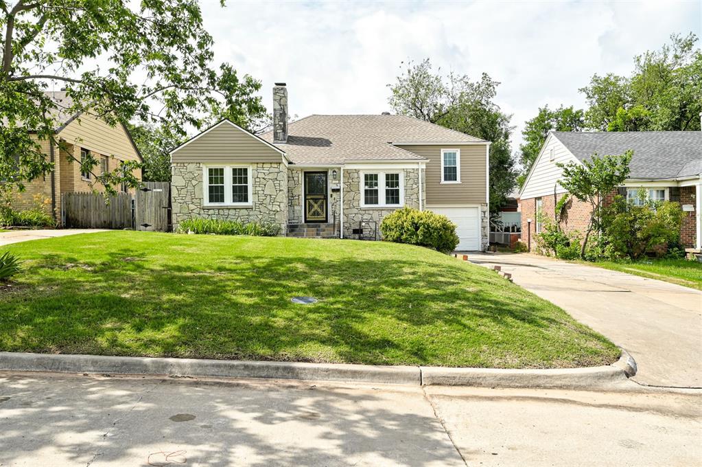 Welcome to this beautifully remodeled bungalow that perfectly blends classic charm with modern updates. Featuring 3 spacious bedrooms and 2 full bathrooms, this home offers a thoughtfully designed layout ideal for comfortable living and entertaining. The updated kitchen boasts sleek new appliances, quartz countertops, and stylish cabinetry, while both bathrooms have been tastefully renovated with contemporary finishes. Enjoy the warmth of refinished original hardwood floors throughout and cozy up by the inviting gas fireplace in the living room. An attached single-car garage adds convenience, and the generous backyard provides plenty of space for play, gardening, or relaxing outdoors. Situated on a good-sized lot in a sought-after location, you’ll love being just moments from the park, with quick access to Western Avenue, downtown, major highways, and neighborhood favorites like Whole Foods. This move-in ready home is a rare find—don’t miss your chance to own a piece of charm in the heart of it all.