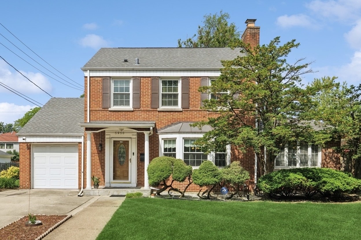 Welcome to this classic 4-bedroom, 2.1-bath Jumbo Georgian beauty in picturesque Sauganash, nestled on an expansive, park-like lot-a true gardener's delight! Enjoy your private retreat within the city with a spacious, expanded interior that preserves classic charm while offering modern updates for today's lifestyle. On the main level, you'll find a large family room, a convenient home office with patio access, and a luxurious primary suite. The spacious living room boasts a pretty bay window, a wood-burning fireplace, and charming built-in bookcases-perfect for showcasing your favorite reads and treasures. The formal dining room provides an elegant space for entertaining. The updated kitchen features oak cabinetry, granite countertops, and select stainless steel appliances, seamlessly connecting to the expansive family room outfitted with Pella windows and a new rear door that invites nature in. Upstairs, three additional nicely-sized bedrooms and a refreshed full bath await. The inviting lower level includes a recreation room, along with a separate utility area offering abundant storage and a handy workbench. The attached garage provides full attic storage. This well-maintained home comes with many updates, including an Ecobee thermostat, all copper plumbing, a water filtration system in the kitchen, a security system, and a newer washer and dryer. Embrace all that Sauganash has to offer with a short walk to top-notch schools, nearby parks, tennis courts, and beautiful wooded bike trails that stretch for miles. Enjoy convenient access to CTA transportation and expressways, with close proximity to Alarmist Brewery, Whole Foods, and Starbucks. Don't miss the opportunity to own this delightful home in a wonderful community!