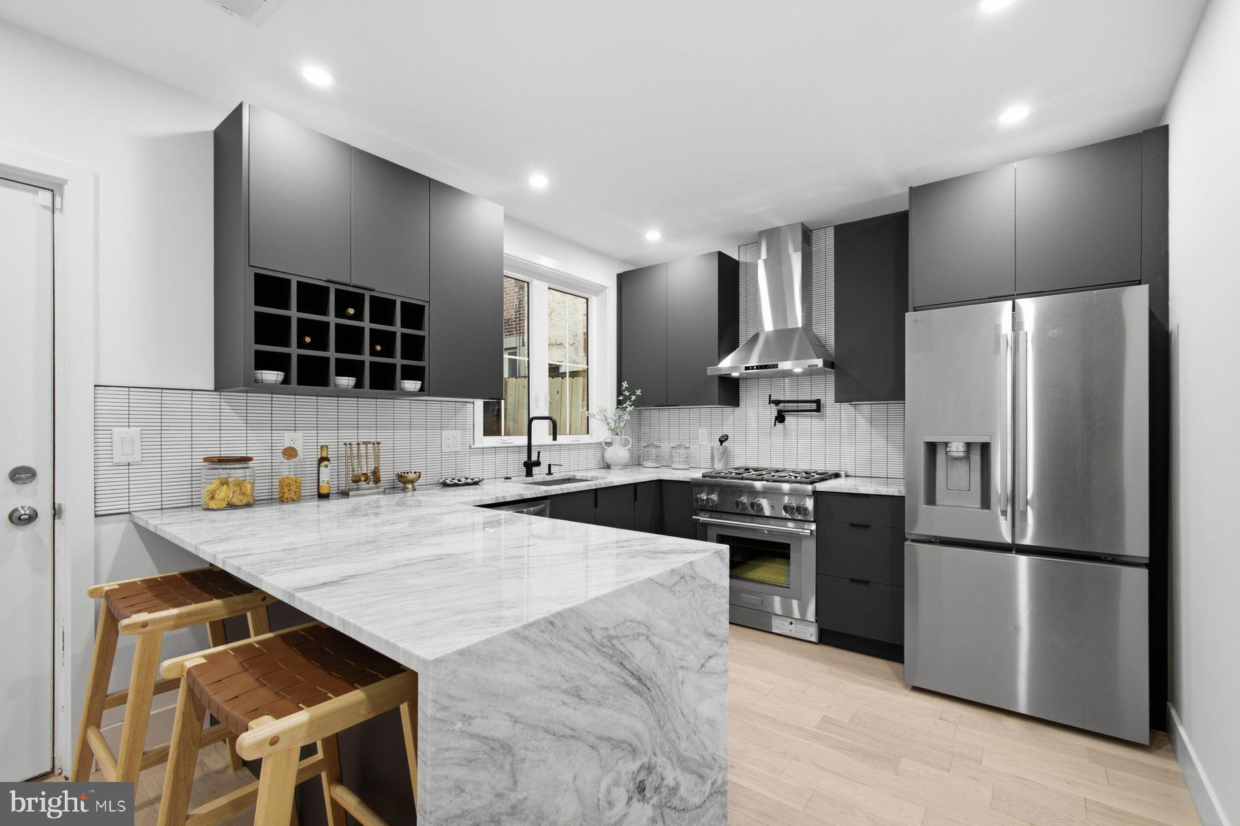 **LIMITED TIME OFFER **Seller is offering $10,000 towards closing cost. **Sellers preferred lender is offering financing with a rate buy down - inquire for more details!** 10 Year Tax Abatement and a one year builder warranty! Newly constructed and thoughtfully designed, 1146 N Galloway Street offers a refined take on modern living in the heart of Northern Liberties. Spanning nearly 2,500 square feet across four levels, this 5 bedroom, 3.5 bath residence pairs clean architectural lines with warm, natural finishes and flexible spaces designed for everyday life. Wide-plank white oak flooring flows throughout the home, while the striking kitchen serves as the centerpiece of the main living level. Sleek contemporary cabinetry, stone countertops, a waterfall island, and premium Thermador and LG appliances package create a polished space equally suited to entertaining and daily living. Just beyond the kitchen is the private rear yard extending the living space outdoors. The third floor is dedicated to the light-filled primary suite, complete with a walk-in closet and beautifully appointed fully tiled bath featuring a double vanity, soaking tub, and walk-in shower. Generously sized secondary bedrooms, additional full baths, a dedicated laundry area, and a fully finished lower level provide ample room for guests, a home office, fitness space, or media room. Above it all, a private rooftop deck captures sweeping views of the Philadelphia skyline and creates an impressive setting for outdoor entertaining. Additional highlights include dual-zone HVAC, a 10 year tax abatement, a one-year builder warranty. Set on a quiet residential block in Northern Liberties, the home offers easy access to the neighborhood’s restaurants, cafés, shops, and entertainment while remaining moments from Center City and the surrounding neighborhoods. 1146 N Galloway Street is a distinctive opportunity to enjoy new construction, generous space, and contemporary design in one of Philadelphia’s most sought after neighborhoods.