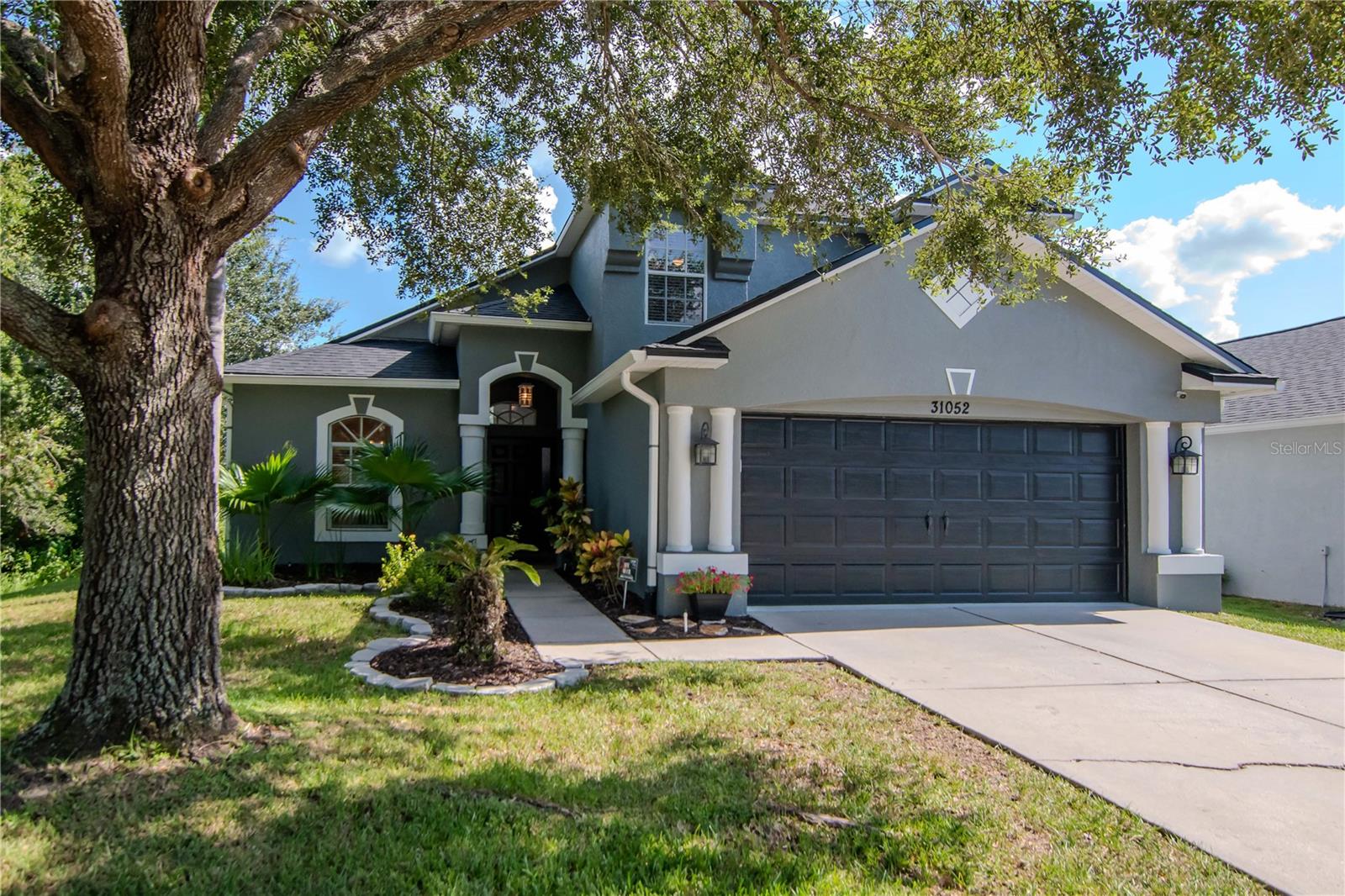 This beautiful 3-bedroom, 2.5-bathroom home is tucked inside a desirable gated community in Wesley Chapel and comes with the peace of mind of a brand-new roof (2025). 
As you step inside, you’ll be greeted by an abundance of natural light, soaring vaulted ceilings, and a spacious layout designed for both comfort and function. The primary suite and laundry room are conveniently located on the first floor, while the newly installed plank tile flooring adds modern style and durability throughout the main living areas.
The home offers a seamless flow with a great room, dining room, and eat-in kitchen that make entertaining a breeze. The kitchen is equipped with newer stainless-steel appliances and plenty of counter space for meal prep. Just off the kitchen, step outside to your own private retreat—a covered and extended lanai overlooking the fully fenced backyard with three gates, a pond view, and no rear neighbors.
Upstairs, you’ll find two generously sized bedrooms, each featuring a charming window seat perfect for reading or relaxing. A spacious loft area provides additional flexible living space, ideal for a playroom, office, or media room.
Thoughtful touches like custom window treatments and decorative wood awnings add warmth and character, blending beautifully with the home’s light fixtures and overall design. Recent updates include a 2019 AC system and a 2018 water heater, ensuring efficiency and comfort.
With only one neighboring home and a peaceful conservation area on the other side, you’ll enjoy both privacy and serenity. 
The amenities that are included are amazing Meadowpointe offers a club house with newly updated pool, playground, volleyball court, basketball court, tennis courts, and too much to mention. This move-in-ready home is conveniently located near everything Wesley Chapel has to offer—top-rated schools, hospitals, shopping, dining, interstates, and more.
All that’s left to do is move in and start enjoying the lifestyle you’ve been waiting for! Sellers are also offering $5k towards buyers closing costs, prepaids or interest rate buydown.
