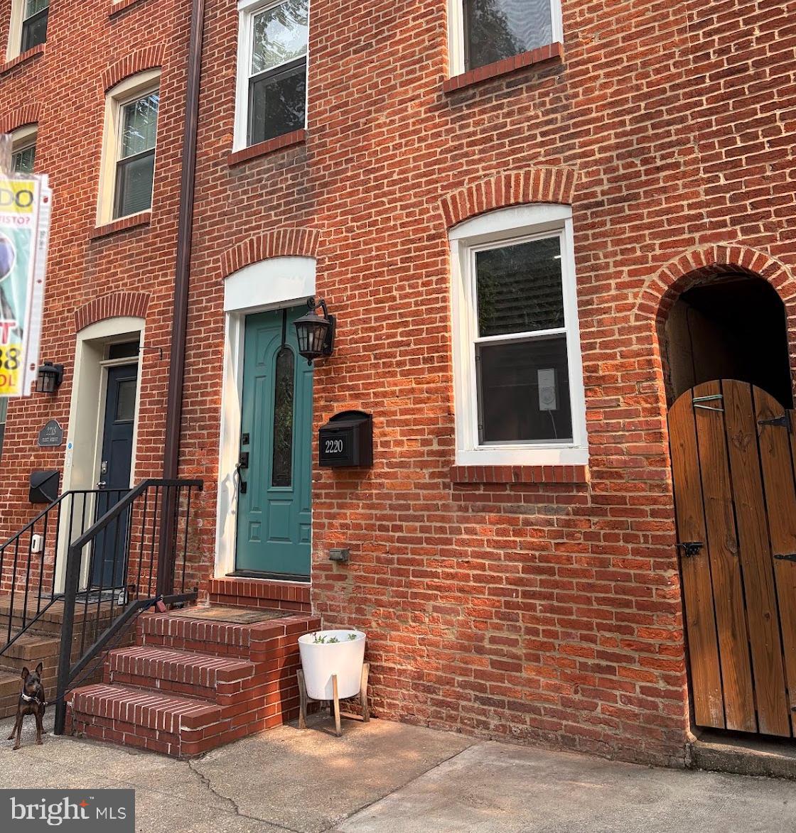 Welcome to this beautifully renovated 3-bedroom, 2-bathroom home in the highly sought-after Canton/Fells Point neighborhood. Ideally located less than a 3-minute walk from both the waterfront and Patterson Park, this home offers the perfect blend of city living and neighborhood charm. Step inside to discover an open, light-filled interior featuring hardwood floors, recessed lighting, and modern finishes throughout. The updated kitchen boasts stainless steel appliances, granite countertops, solid wood green cabinetry, and a stylish backsplash, with direct access to a charming private patio—perfect for outdoor dining or relaxing.  The spacious primary suite features generous closet space and a beautifully appointed en suite bathroom.  On the second level a second  bedroom and a tastefully updated bathroom with elegant mosaic tile along with a third bedroom offers flexibility for guests, a home office, or additional living space.One of the home's standout features is the two-tier rooftop deck, offering breathtaking panoramic views of the Baltimore skyline and harbor—an ideal setting for entertaining or unwinding after a long day.  Located just minutes from the shops, restaurants in Canton, Fells Point, and Harbor East, as well as easy access to Johns Hopkins Medical Center, this home also provides convenient access to I-95, I-83, and I-695, making commuting throughout the region effortless.  Don't miss the opportunity  to live in one of Baltimore's most desirable neighborhoods.