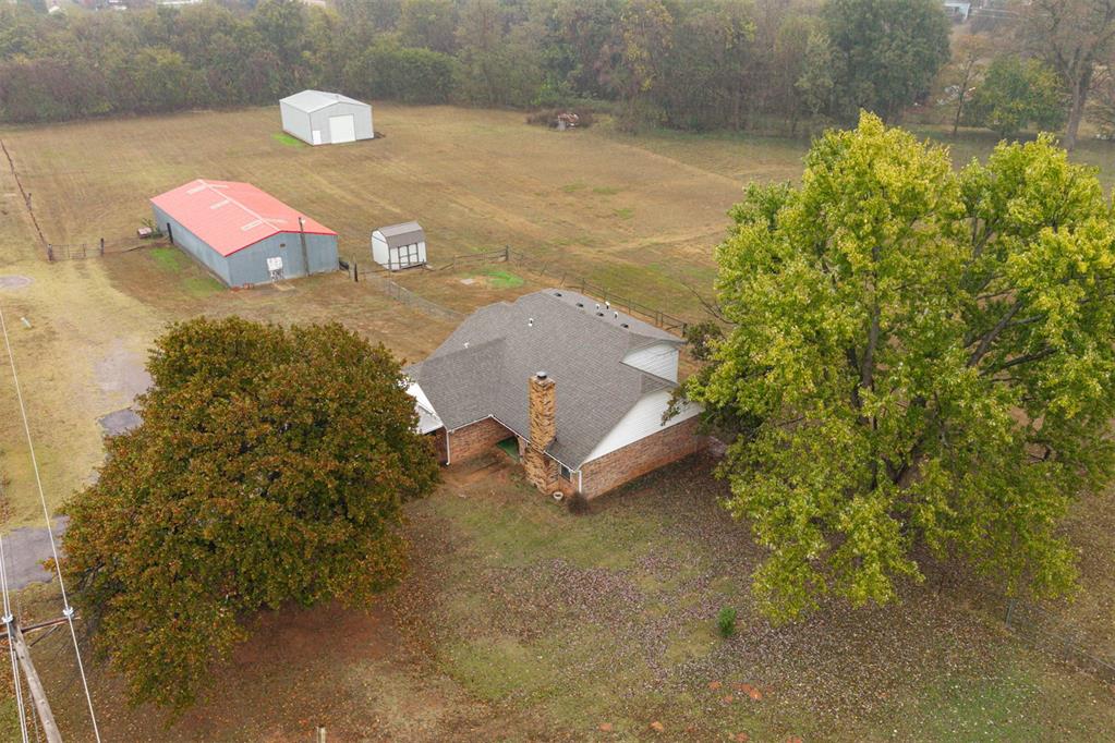 Experience the perfect balance of space, comfort, and location with this charming 4-bedroom, 3-bath home on 4.22 fully fenced acres in the highly sought-after Moore Public School District. With 1,817 sq. ft. of living space, this property offers plenty of room to stretch out, entertain, and create the lifestyle you’ve been dreaming of.

Step inside to find a welcoming, open layout with a versatile converted garage—ideal for a guest suite, home office, or creative studio. The kitchen features a brand-new dishwasher and a refrigerator that stays, making your move-in even easier.

Outside, the possibilities are endless. The 7-stall horse barn with water and electric is perfect for equestrian use or hobby farming. A 40x30 shop adds space for storage, tools, or future projects, and there’s also a storage shed for extra convenience. The 2-car carport provides covered parking, while the fully fenced property offers peace of mind for kids, pets, and livestock.

If you’ve been searching for a home that combines privacy, practicality, and proximity to town—this one delivers it all.