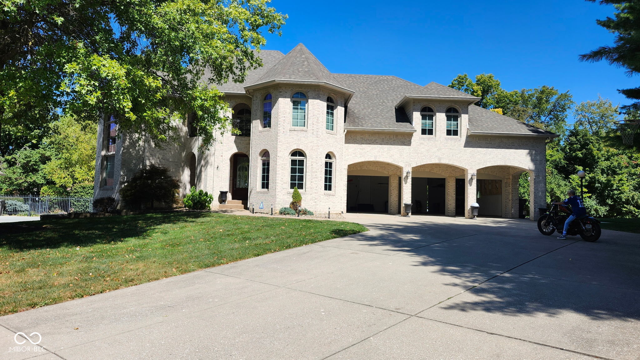 Elegant All-Brick Estate with Pool, Theater & Wine Cellar    Welcome to this beautifully maintained 5-bedroom, 7-bath residence tucked away on a quiet street with excellent access to nearby amenities. The all-brick exterior offers timeless curb appeal, while the home's spacious design provides a perfect blend of luxury and comfort.    A grand entrance with a sweeping spiral staircase opens to four spacious upstairs bedrooms, while the main level features a private master suite, dedicated office, and a chef's kitchen ideal for entertaining.    The finished basement is a true retreat, complete with a state-of-the-art movie theater, full kitchen, and custom wine cellar-perfect for hosting gatherings or enjoying cozy nights at home.    Step outside to an entertainer's dream backyard with a sparkling in-ground pool, relaxing hot tub, and an enclosed porch for year-round enjoyment. A 3-car garage rounds out this exceptional property.    This home combines elegant architecture, modern amenities, and thoughtfully designed spaces-ideal for both everyday living and entertaining.