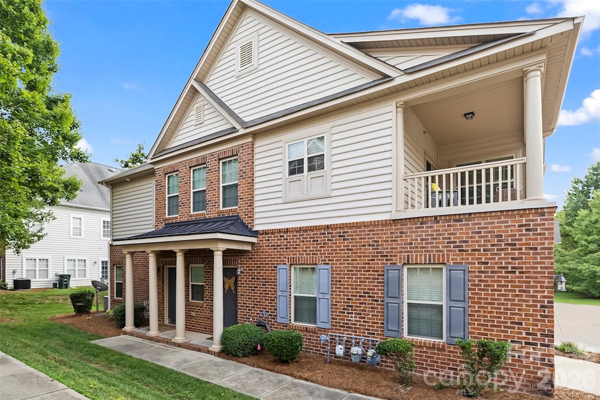 Don't miss this beautifully maintained and upgraded 2 bedroom, 2 bath condo in the prime Ballantyne area of South Charlotte. Architectural style abounds with an open floor plan, vaulted ceilings, neutral decor and tons of natural light. Pristine hardwoods in the main areas. Gourmet kitchen has 42" cherry cabinetry, custom tile backsplash, granite counters and an upgraded SS appliance package featuring gas cooking. The cozy living room is warm and welcoming with a gas log fireplace, and sliding doors leading out to a relaxing covered terrace offering peace and tranquility. Spacious primary bedroom with abundant storage in the walk-in closet, a trey ceiling and charming window bench. Adjoining primary bath has dual sinks, a garden tub and separate shower. The secondary bedroom is sizable as well. All of this plus the attached 1-car garage with custom workbench that has direct entry into the unit. Around the corner is a 1-minute walk to the sparkling community pool with cabana. The washer, dryer and refrigerator are included, and rentals are permitted within the complex. Water/sewer is included in the HOA dues. Conveniently located near highly rated schools as well as a variety of upscale shops and restaurants, including Ballantyne Bowl and the new Wegman's. It's also in close proximity to I-485 providing access to all of Charlotte and beyond. This home delivers an outstanding opportunity to access one of Charlotte's most desirable communities at an amazing price.