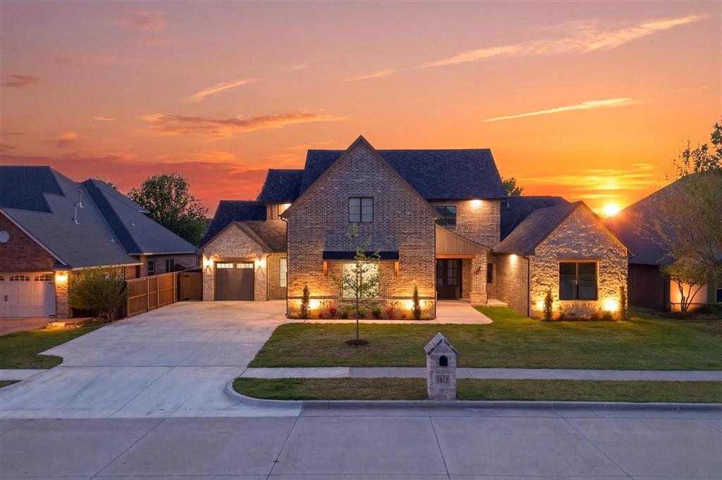 Absolute showstopper in the highly sought-after Arbor Lake addition in West Norman! Seamlessly blending modern design with timeless character, and featuring 4 bedrooms, 3 full bathrooms, a media room, and a versatile layout, this gorgeous home offers an expansive 3,141sqft of thoughtfully designed living space. The main level is anchored by a stunning living room with a floor-to-ceiling stone gas fireplace, rich wood flooring, and striking ceiling beams that add warmth and architectural interest. Framed entryways and arched openings create a natural flow into the dining and kitchen areas, where oversized picture windows flood the home with natural light. The kitchen is truly a masterpiece, highlighted by a large quartz island with abundant storage, stainless appliances, double ovens, and a built-in microwave. An expansive Butler’s pantry elevates functionality with its own sink and countertop, unique designer backsplash, and exceptional storage. The primary suite is privately situated downstairs and features vaulted ceilings with transom windows, creating a bright and airy retreat. The spa-like en suite includes a modern double vanity, soaking tub, and private shower. The oversized closet is a standout, complete with three levels of hanging space, built-in dresser drawers, and direct access to the utility room. A secondary bedroom or office downstairs also features vaulted ceilings and access to a beautifully finished full bath. Upstairs offers two additional bedrooms, a full bathroom, and a spacious game/media room complete with a kitchenette, perfect for entertaining. Situated on a nearly quarter-acre lot, the exterior features upgraded concrete work with a sidewalk extending from the back gate to the patio, and all in one of West Norman’s most desirable neighborhoods, with playgrounds, a stocked lake and walking trails. Also with convenient access to I-35, near OU, 30 minutes to Oklahoma City and Tinker AFB, and only minutes from premier shopping and dining!