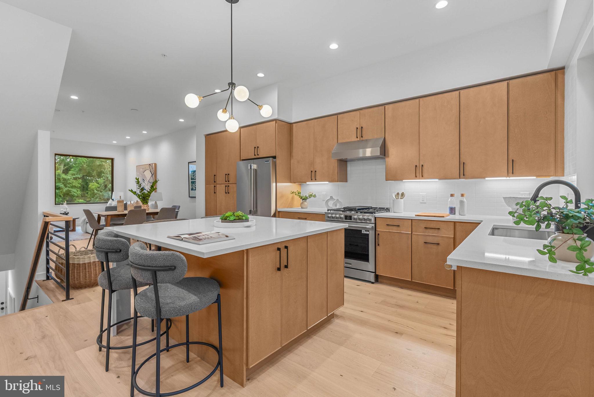 Welcome to The Greens at Delmar, an exclusive collection of just eight newly constructed residences perched above Manayunk, where sophisticated city living meets an unexpected connection to nature. Each home offers 4 bedrooms, 3.5 bathrooms, two-car parking, multiple outdoor spaces, a 10-year tax abatement, and a 1-year builder’s warranty.Inside, refined contemporary design pairs wide-plank white oak flooring, oversized windows, and abundant natural light with elevated finishes throughout. The open main level flows effortlessly from spacious living and dining areas into a beautifully appointed kitchen featuring desert oak slim-shaker cabinetry, quartz countertops, Frigidaire Professional appliances, and a generous center island. Step outside to your own landscaped front yard with pavers, creating an additional space to grill, entertain, or unwind.Upstairs, two spacious bedrooms are complemented by two full bathrooms, including an en-suite, and a thoughtfully designed laundry room with built-in cabinetry and a convenient folding ledge.The entire third floor is dedicated to the impressive primary suite, where oversized windows capture views of the surrounding greenery and Philadelphia skyline. A generous walk-through closet leads to the spa-inspired primary bath, complete with a double vanity with LED lighting, an oversized walk-in shower, and a freestanding soaking tub surrounded by natural light.Designed with entertaining in mind, the upper level features a beverage fridge conveniently located just steps from your private roof deck, where sweeping skyline and treetop views create an incredible backdrop from morning to sunset.The lower level offers a private fourth bedroom, half bathroom, generous storage, and a convenient mudroom-style entry from the rear parking area, providing flexibility for guests, a home office, or additional living space.What truly sets The Greens at Delmar apart is the expansive shared green space tucked behind the homes. A rarity among Philadelphia new construction, this defining feature creates an incredible sense of openness and separation, offering a refreshing connection to nature without sacrificing the convenience of city living.When you’re ready to venture out, Main Street Manayunk is just moments away, putting some of the neighborhood’s best dining, drinks, shopping, and entertainment within easy reach. Enjoy dinner and cocktails at The Goat’s Beard, wine and bites at Jake’s & Cooper’s, margaritas at Taqueria Amor, burgers and drinks at Lucky’s Last Chance, brunch at Blondie, or a night along the river at Manayunk Brewing Company. Beyond dining, Manayunk offers charming local boutiques, cafés, the canal and towpath, and a vibrant neighborhood atmosphere just outside your door.The association provides for the care and maintenance of the community’s shared spaces and common areas, helping preserve the thoughtfully designed setting and overall experience at The Greens at Delmar.Taxes and square footage is the responsibility of the buyer to verify independently. Listing contains AI enhanced PhotosOnly three opportunities remain to call The Greens at Delmar home - schedule a private showing today!