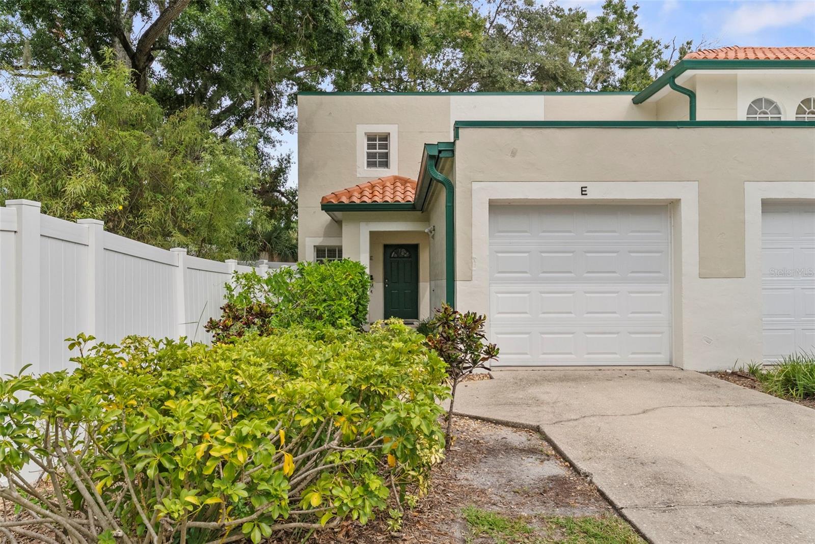 One or more photo(s) has been virtually staged. Discover the perfect blend of comfort, style, and convenience in this updated end-unit townhome, just blocks from scenic walks along the bay on the beautiful Bayshore Blvd! This home is designed for modern living, featuring a pet-friendly HOA with low monthly fees, your own private fenced yard with easy-care turf, and a one-car garage. Move in with peace of mind—no flood insurance required! Inside, you'll love the fresh paint, beautiful hardwood floors, full wall shelving, and elegant crown molding. The kitchen is a true highlight, fully renovated with granite countertops, sleek cabinetry, and stainless steel appliances—great for everyday meals or hosting friends. Enjoy an open living and dining space, a handy walk-in pantry, and a stylish powder bath. Upstairs, find three spacious bedrooms, two updated bathrooms, and a convenient laundry closet. The master suite is a relaxing retreat with a renovated bathroom and modern finishes. Seller would like to leave the new owner their newly purchased washer & dryer they bought specifically for this home. Located in the sought-after Mitchell-Wilson-Plant school zone, this move-in-ready townhome is close to everything. Don’t miss out—come see it for yourself!