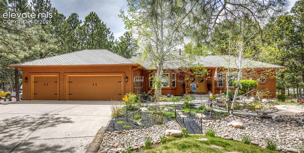 Wonderful 4118 sq ft 3 bedroom & office, 3 1/2 bath stucco walkout rancher with 3 car garage & a perfect floor plan for extended family or special guests with 2 primary suites ~ .81 acre corner cul-de-sac lot with towering pines, aspens, perennials, sunshine & 2 beautiful water features both with water falls. 9' ceilings thru out both levels except for living room which has a cathedral ceiling ~ Silstone kitchen with breakfast bar & eating nook, 5 burner down draft decor gas cooktop & double ovens, shiny hardwood floors thru out the main living areas ~ Double leaded glass front doors ~ dry bar with wine fridge ~ 50x11 trex deck with retractable awning, iron railings & natural gas hookup & grill ~ crown molding & bay windows in kitchen, office & dining room. Built in speakers ~ radon mitigation system ~ Pergola and fountain ~ Antique hutch in dining room ~ Primary suite on main level has 5 piece bath with jetted soaking tub ~ 2nd primary suite in basement is a duplicate on main level primary & also has connected full bath with jetted soaking tub, walk in shower, marble counters & 11x9 walk in closet ~ Dual 50 gallon hot water heaters ~ Dual furnaces ~ Pellet stove can heat the entire main level ~ Curved walls & stairway, rounded corners & all windows are above grade~ 2 1/2 year old class 4 roof ~ perfect one level living loved & cared for. Easy access to I-25, Monument & Palmer Lake.  Woodmoor Improvement Association supplies covenant enforcement & security service for all of Woodmor
